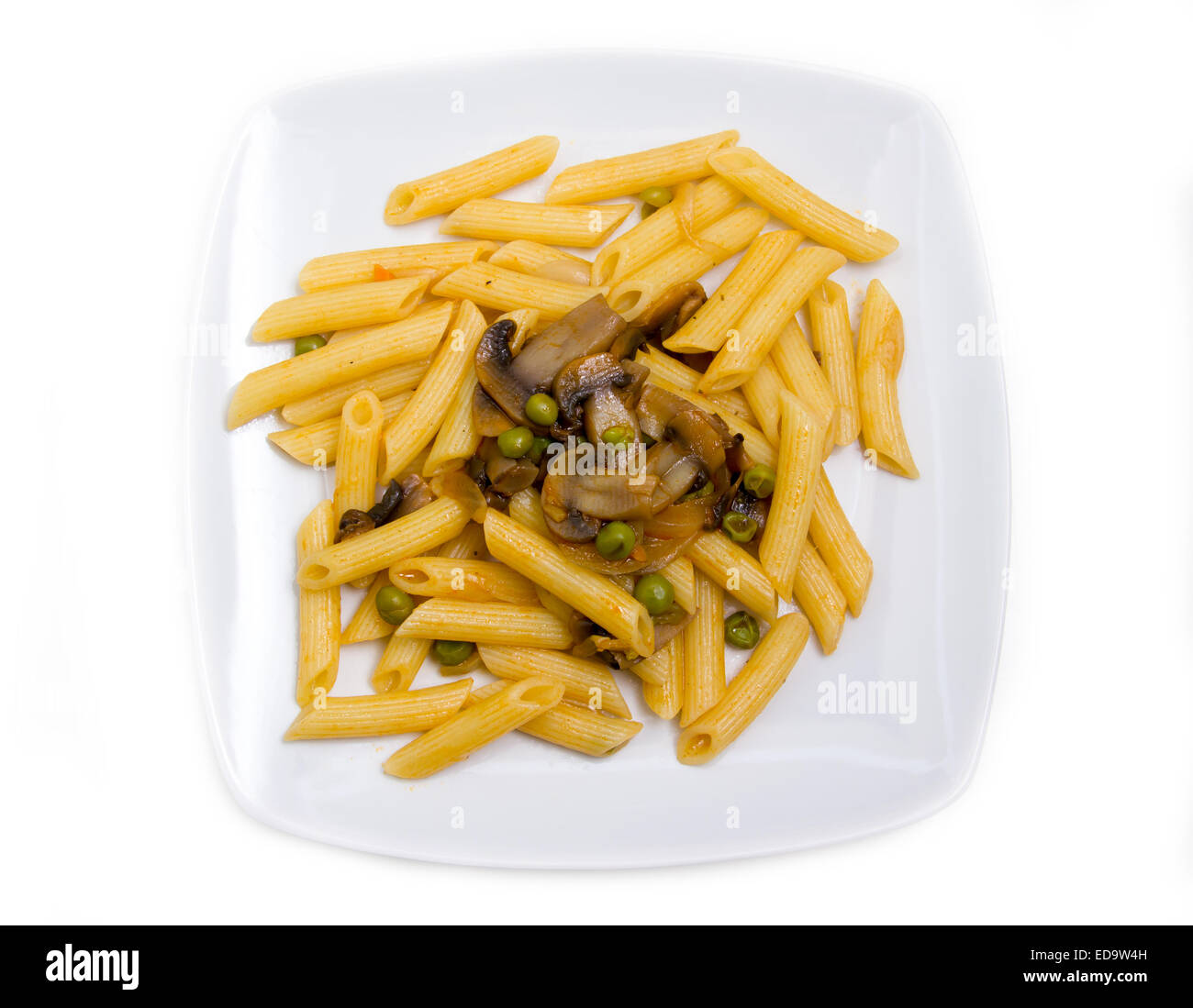 Pasta with mushrooms and peas on white background top view Stock Photo