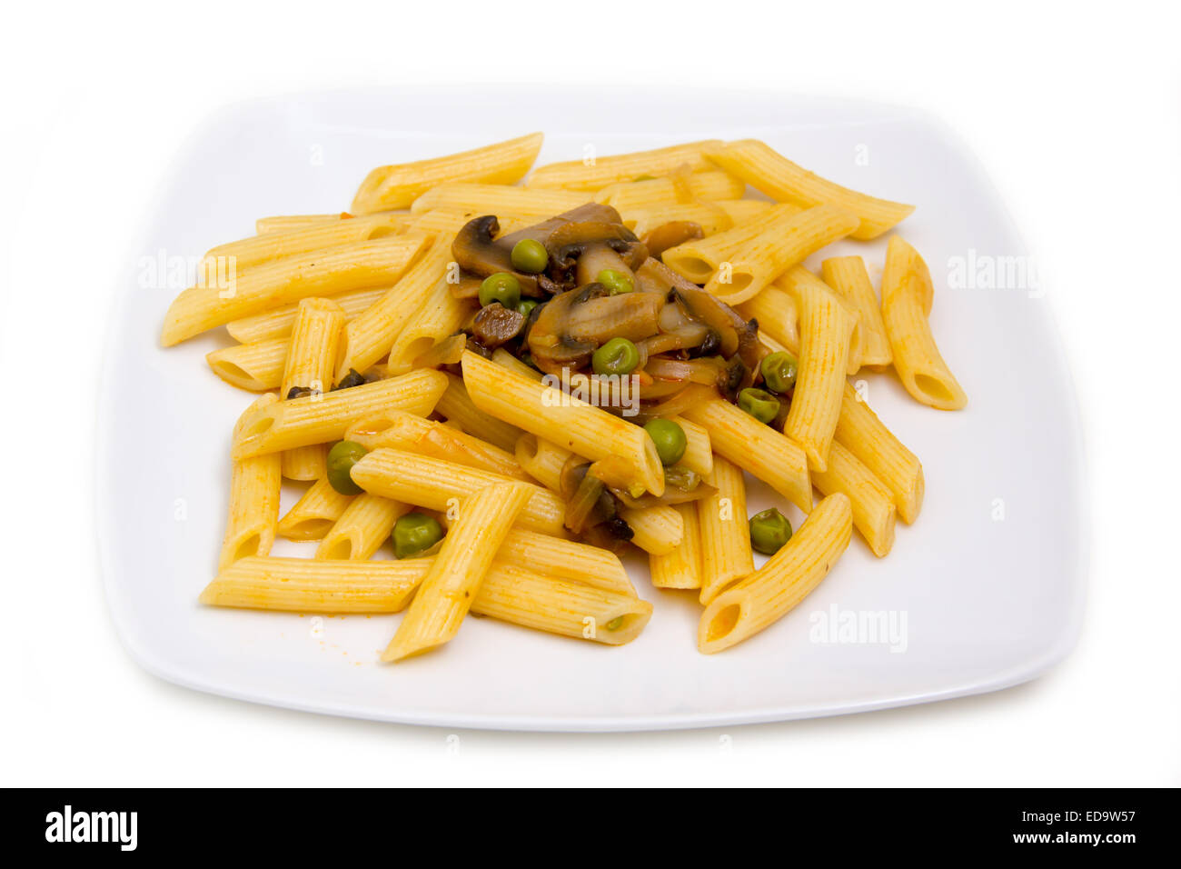 Pasta with mushrooms and peas on white background Stock Photo