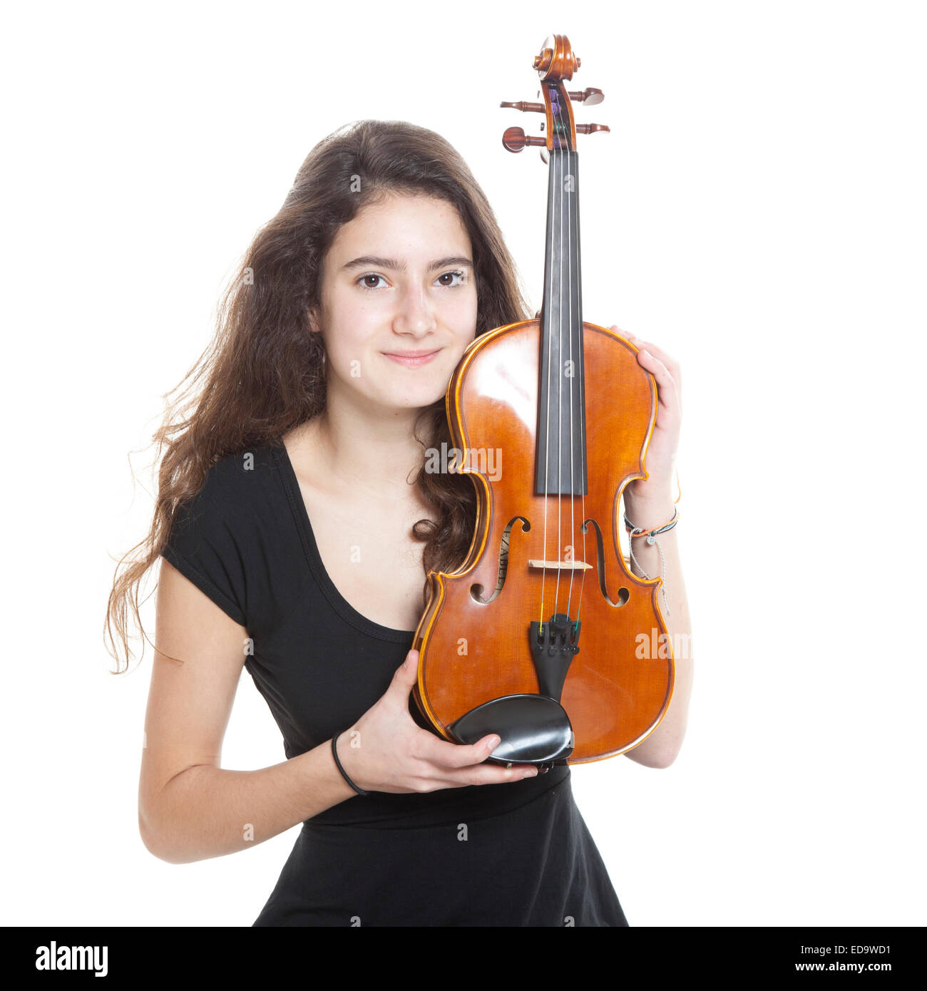 teenage girl holds violin in studio with white background Stock Photo ...