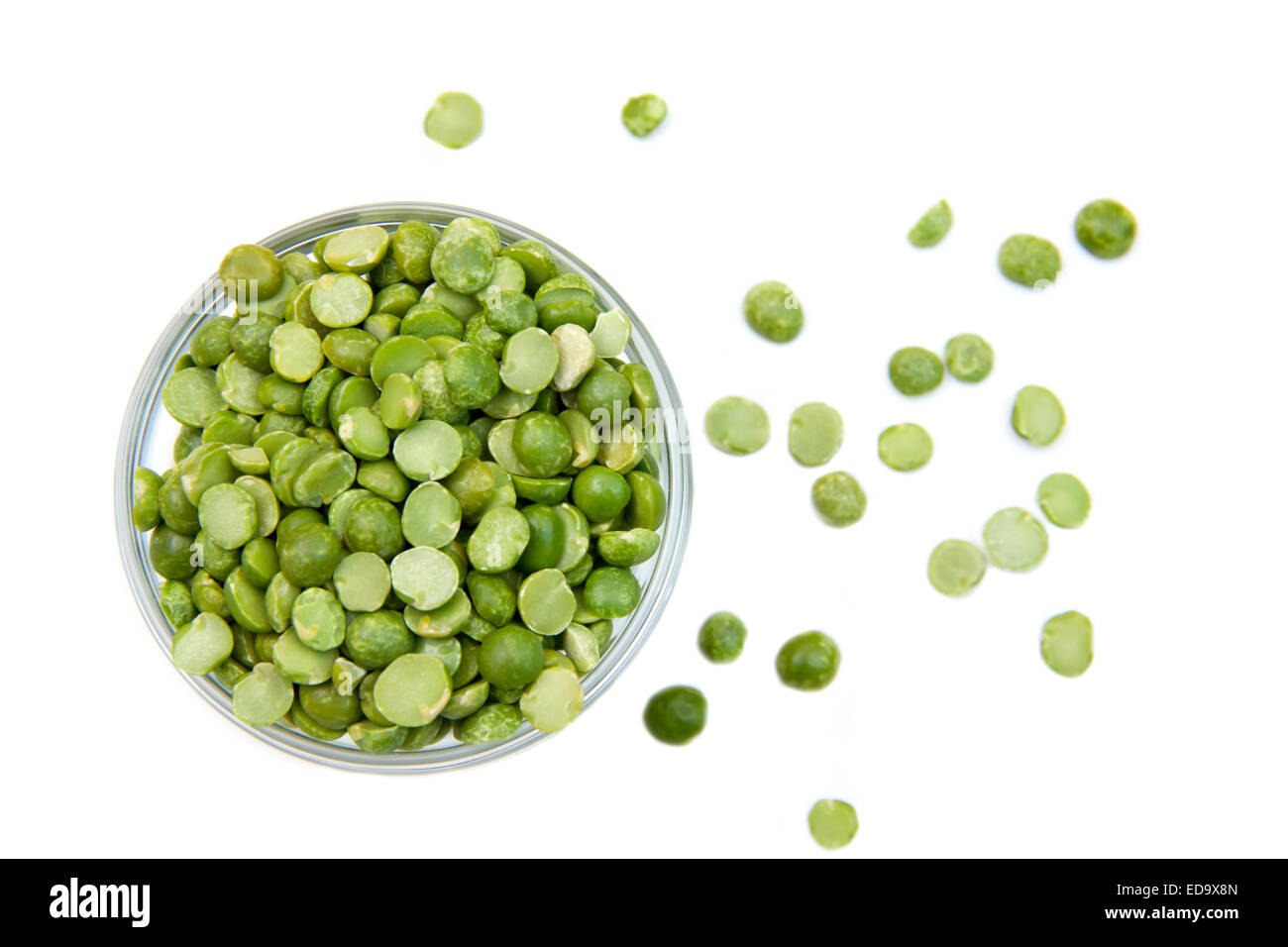 Dried peas in bowl on white background seen from above Stock Photo