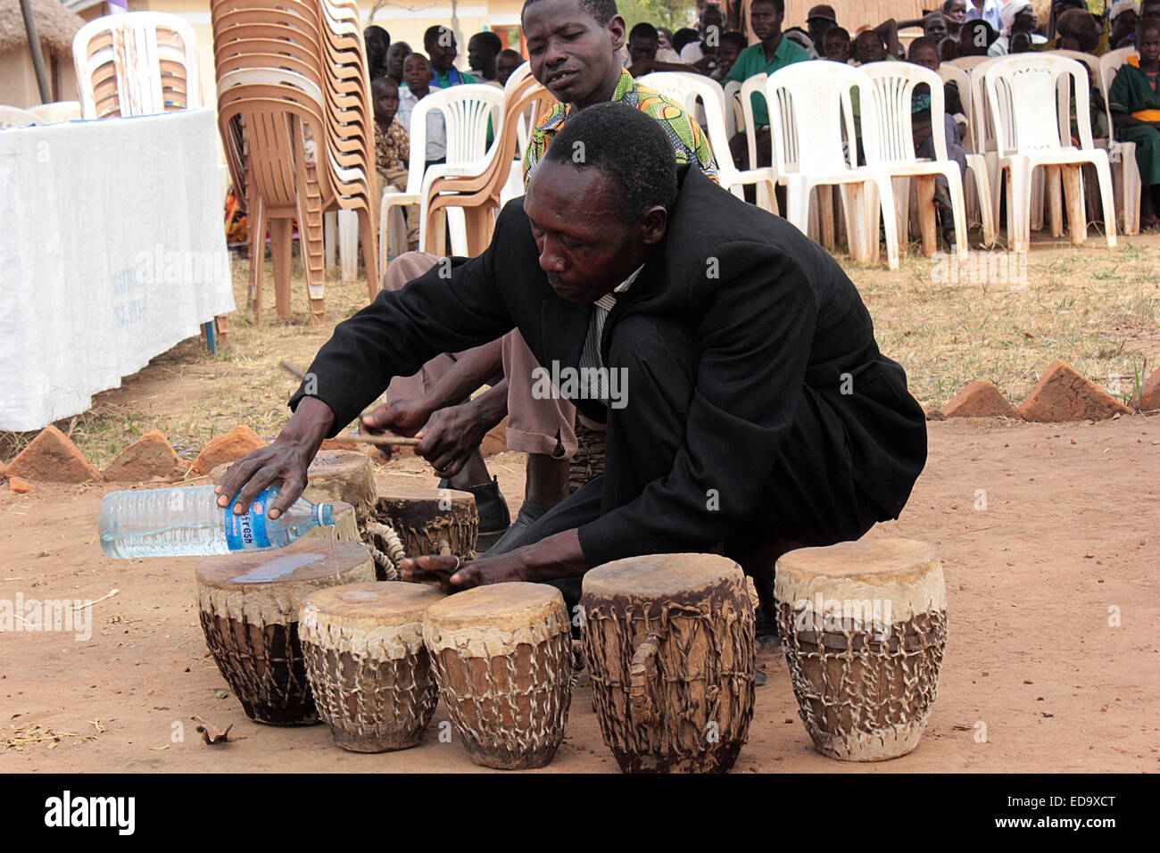 a Traditional artist sets his drums before a show in northern Uganda. In Africa music and dance is crucial in society Stock Photo