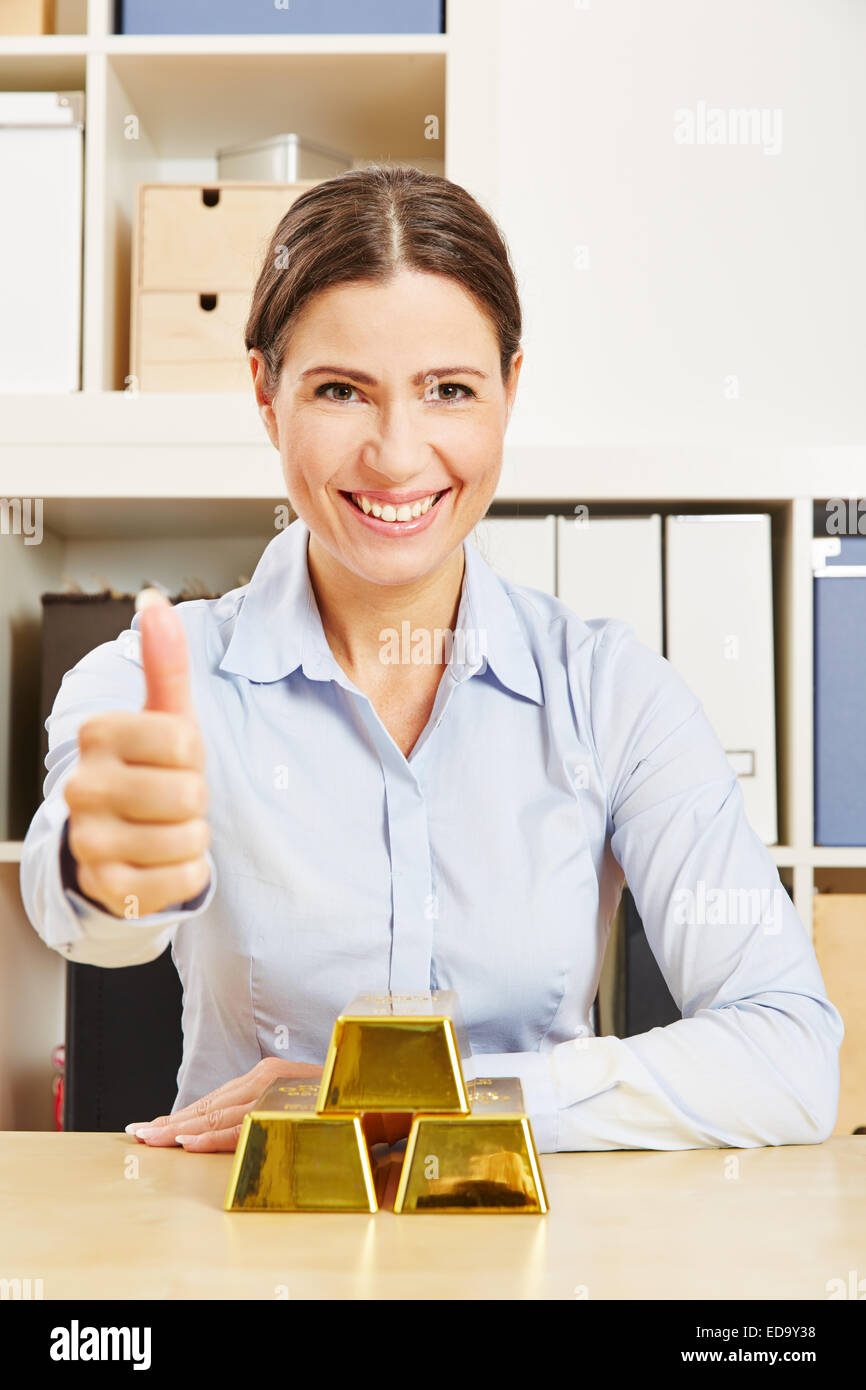 Woman Gold Bars High Resolution Stock Photography and Images Alamy