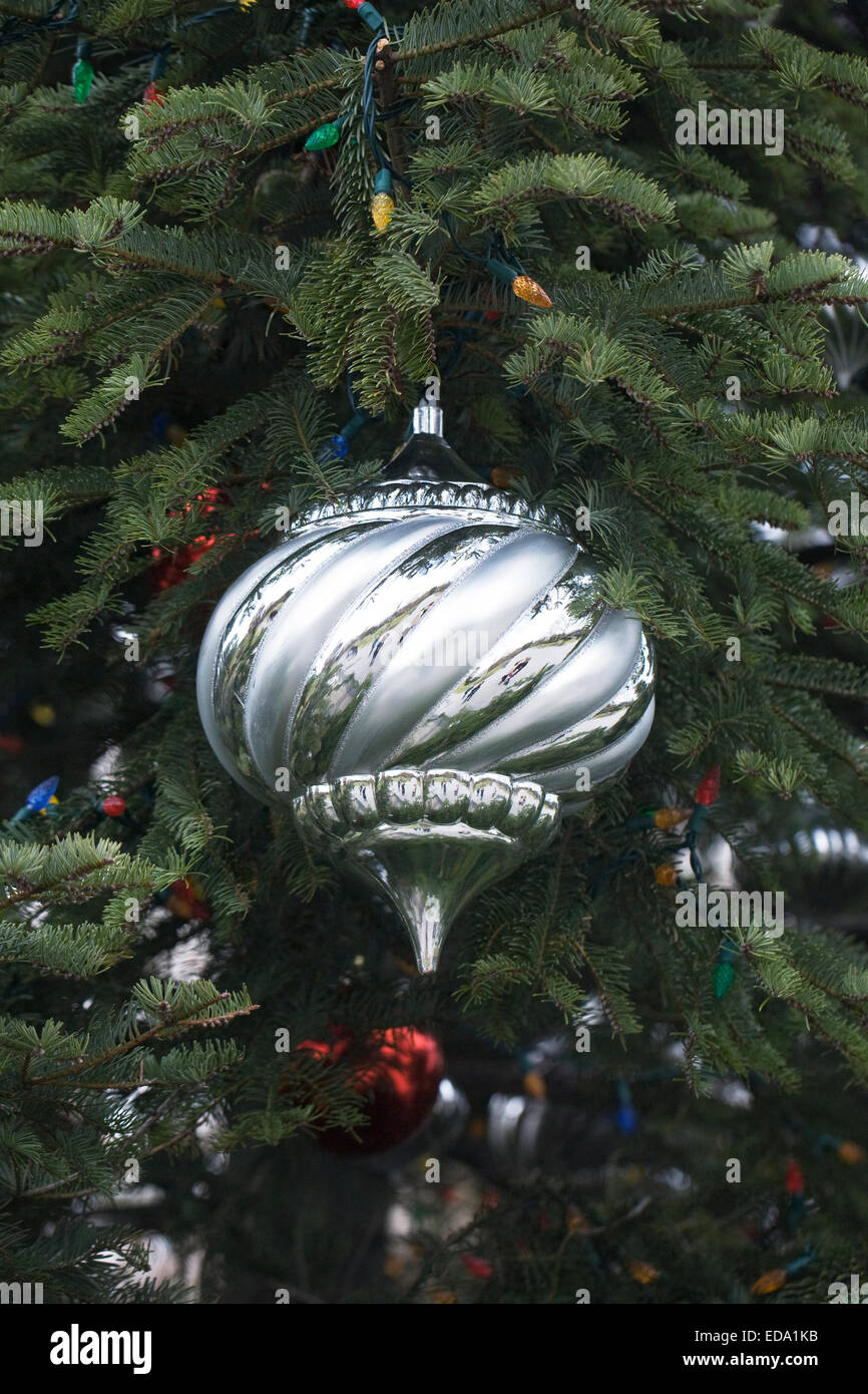 Decorative silver bauble on a Christmas tree Stock Photo - Alamy