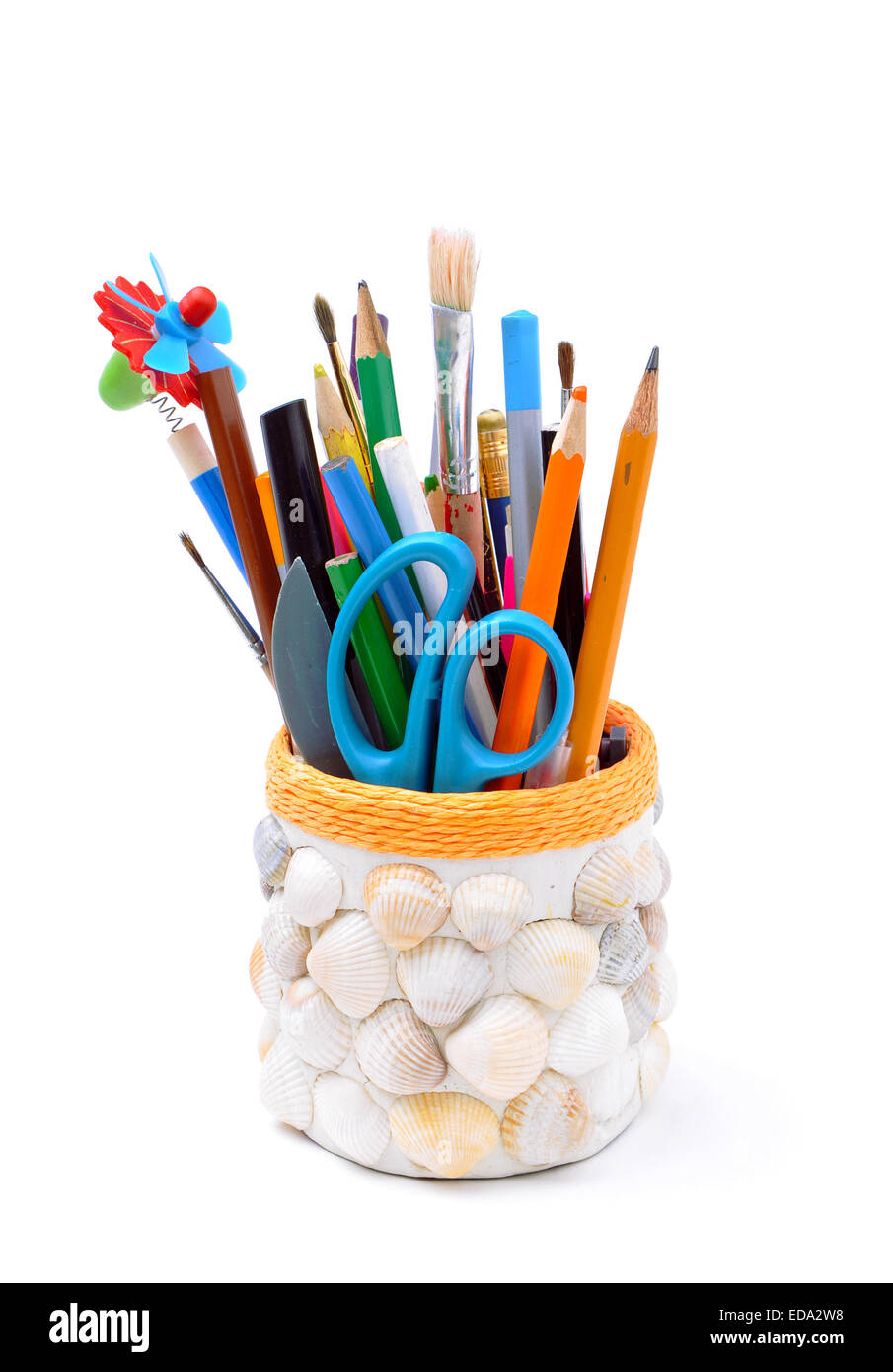 pencils, brushes, plastic knife, scissors in handmade pencil-box isolated Stock Photo