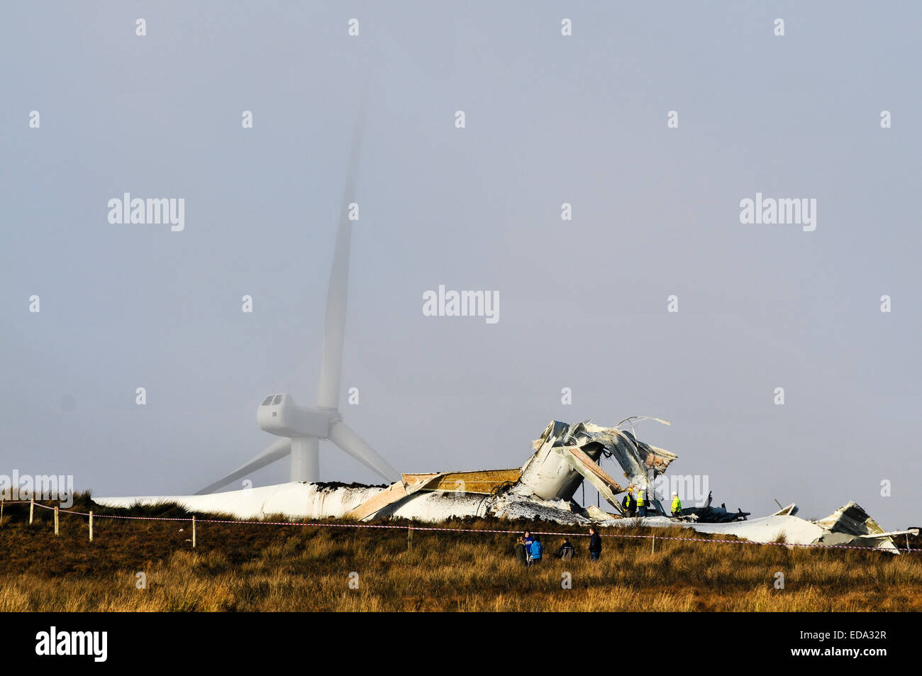 Fintona, Northern Ireland.  3 Jan 2015 - An 80m wind turbine disintegrated and collapsed after developing a fault.  Local residents say the Screggagh wind farm on Murley mountain developed a noise which could be heard 10 miles away, before speeding up and finally disintegrating.  Debris, some the size of cars was flung over 1/2 a mile away.  Nobody was injured. Credit:  Stephen Barnes/Alamy Live News Stock Photo