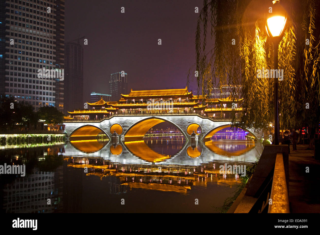 Illuminated Anshun Bridge over the the Jin River at night in the provincial capital of Chengdu in Sichuan, China Stock Photo