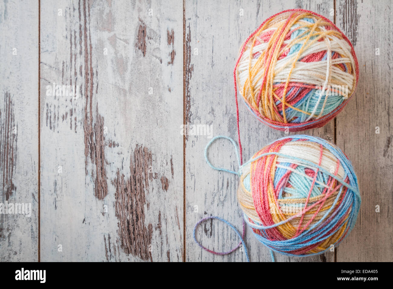 Colorful balls of yarn for knitting on white wooden table Stock Photo ...