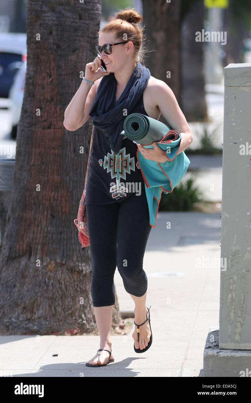 Amy Adams exits her yoga class carrying her mat and chatting on her cell  phone. Featuring: Amy Adams Where: Los Angeles, California, United States  When: 01 Jul 2014 Stock Photo - Alamy