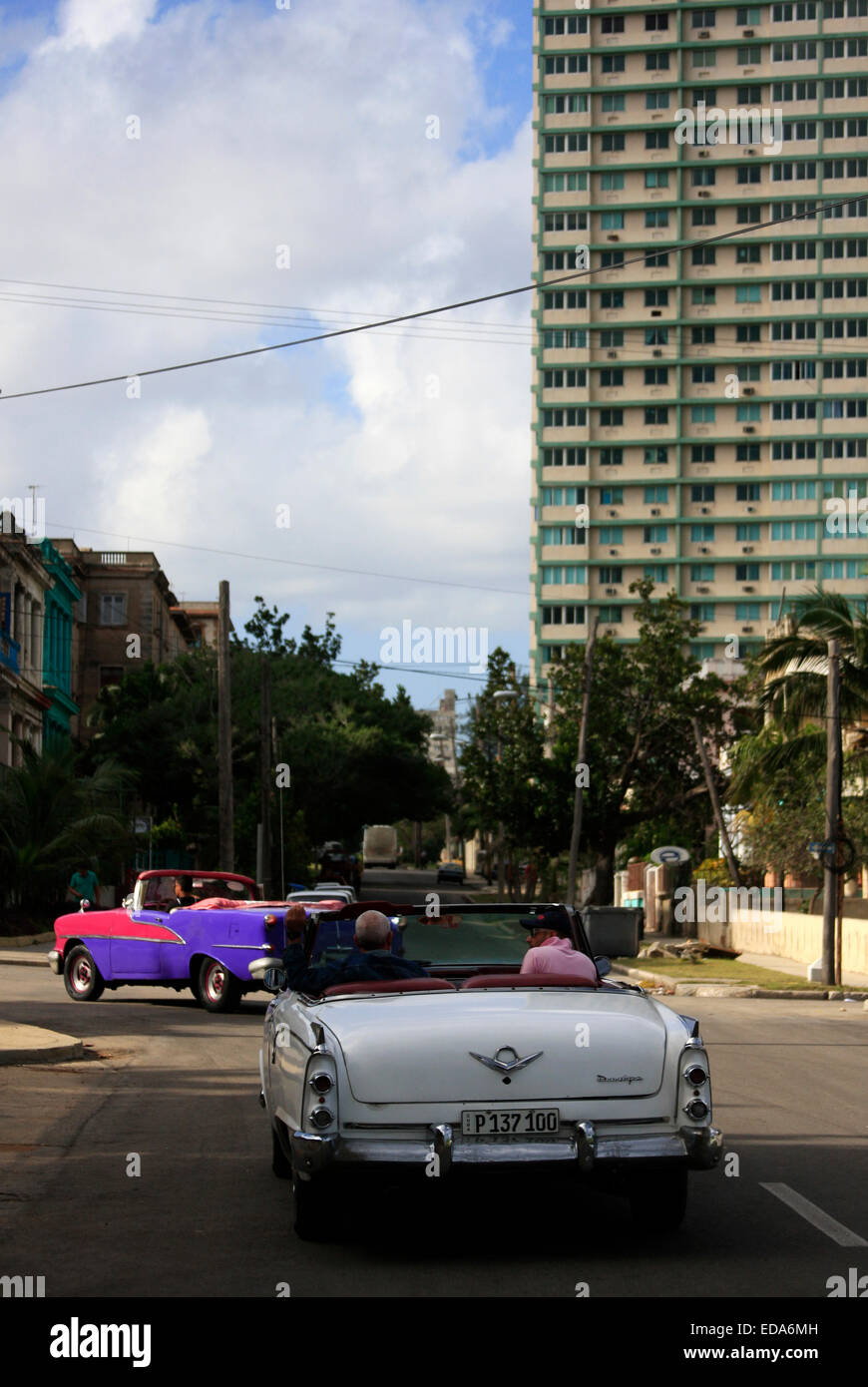 Vintage convertible classic cars driving in the streets of Havana, Cuba Stock Photo