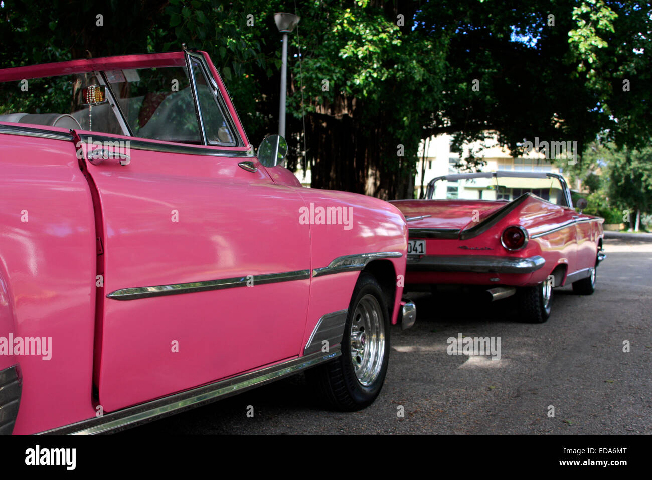 Classic American convertible vintage cars lined parked in a street in Havana, Cuba Stock Photo
