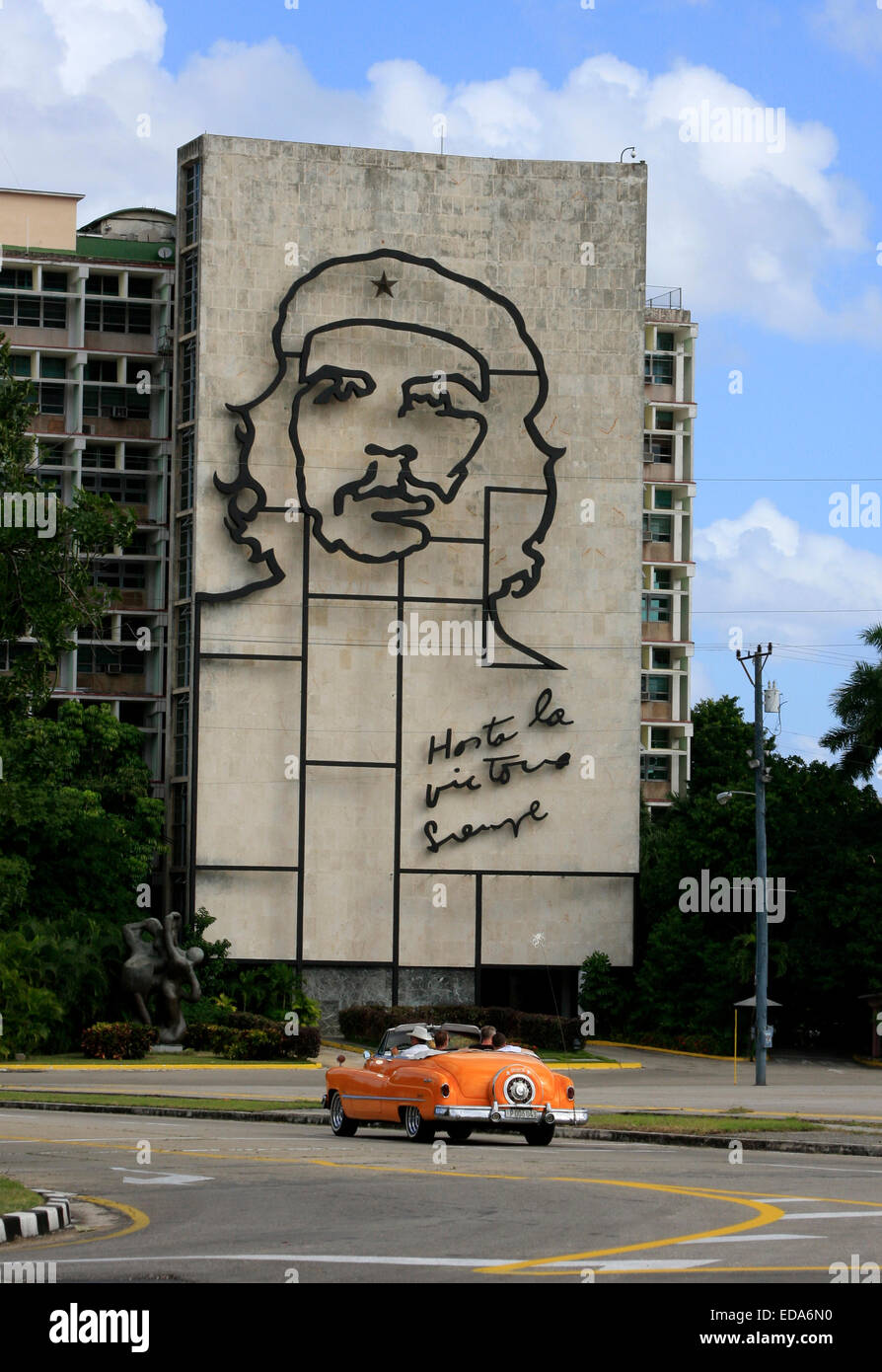 Old American Buick car driving in front of the Ministry of Interior Building in Plaza de la Revolucion, Havana, Cuba Stock Photo