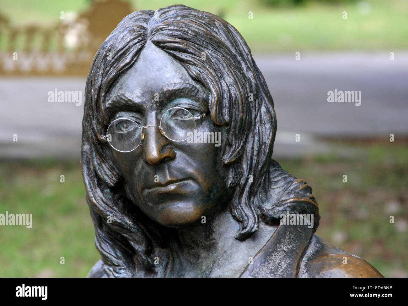 Sculpture of John Lennon sitting on a bench in John Lennon Park, located in the Vedado district of Havana, Cuba Stock Photo