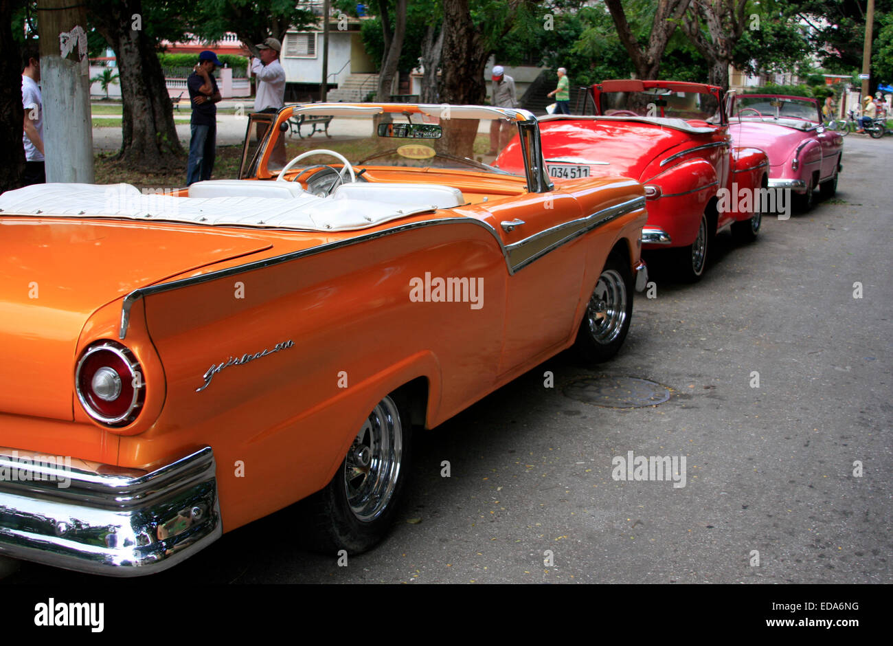 Classic American convertible vintage cars lined parked in a street in Havana, Cuba Stock Photo