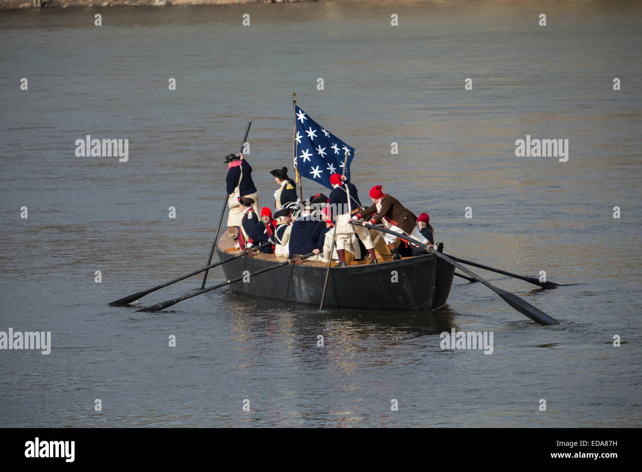 A reenactor portraying General George Washington crosses the Delaware River on Christmas Day. Stock Photo