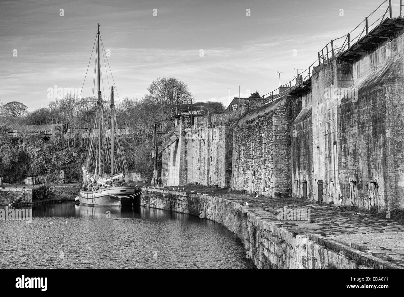 The harbour at Charlestown, Cornwall with the ketch Irene moored up. Stock Photo