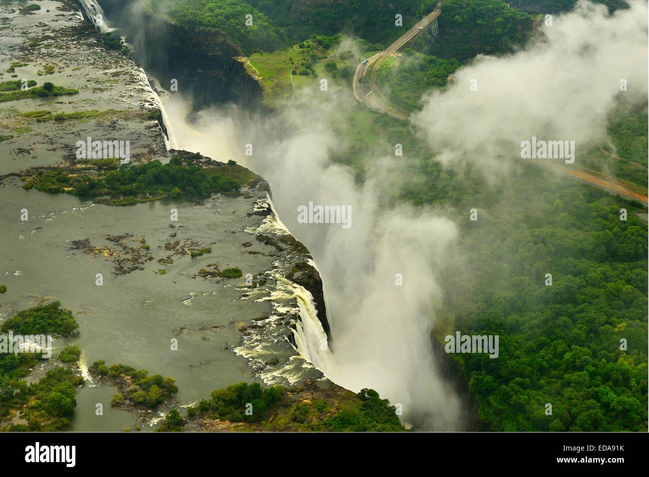 Aerial image of the Victoria Falls and the spray taken from the Zimbabwe side and looking towards Zambia.  Africa, Stock Photo