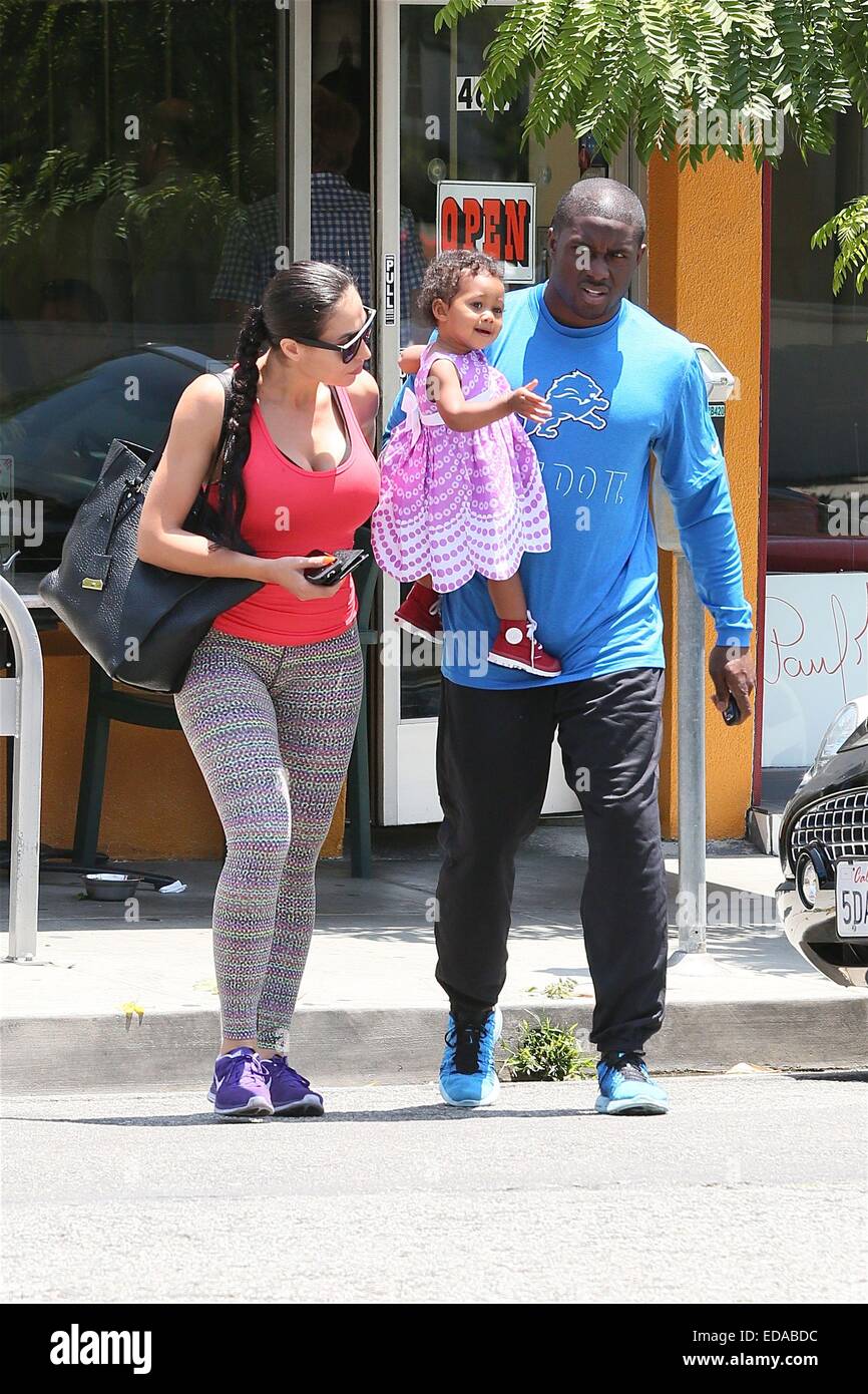 Reggie Bush with his wife Lilit Avagyan and baby daughter Briseis leave a restaurant cafe after having breakfast  Featuring: Briseis Bush,Reggie Bush,Lilit Avagyan Where: Los Angeles, California, United States When: 01 Jul 2014 Stock Photo