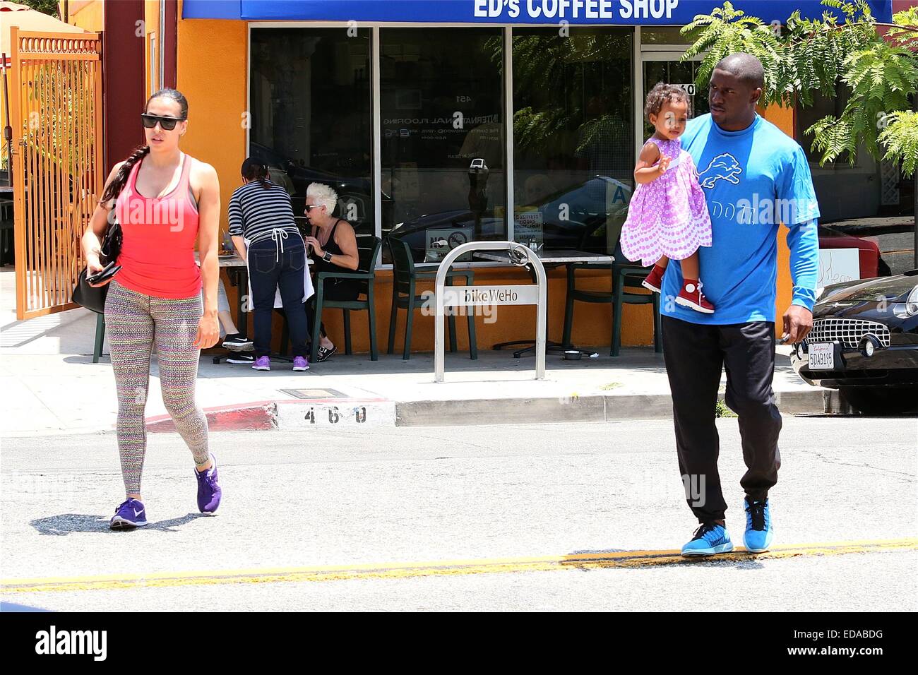 Reggie Bush with his wife Lilit Avagyan and baby daughter Briseis leave a restaurant cafe after having breakfast  Featuring: Briseis Bush,Reggie Bush,Lilit Avagyan Where: Los Angeles, California, United States When: 01 Jul 2014 Stock Photo