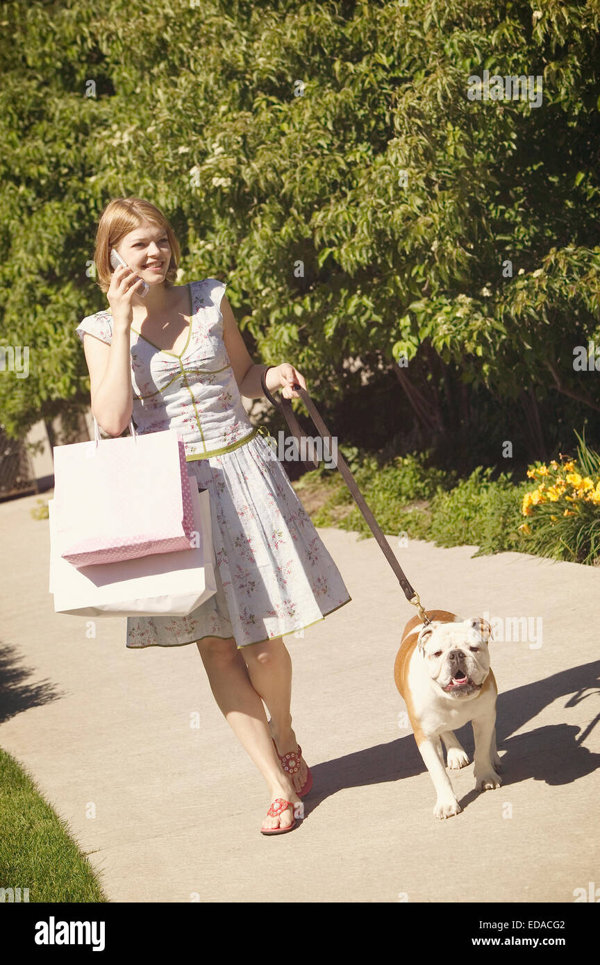 Woman walking with her dog Stock Photo