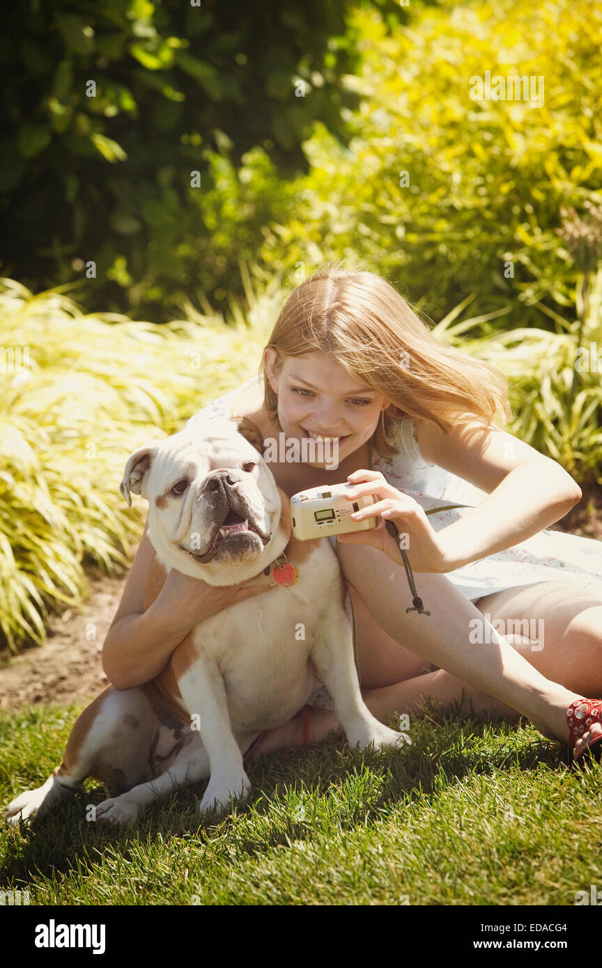 Woman taking a picture of herself and her dog Stock Photo