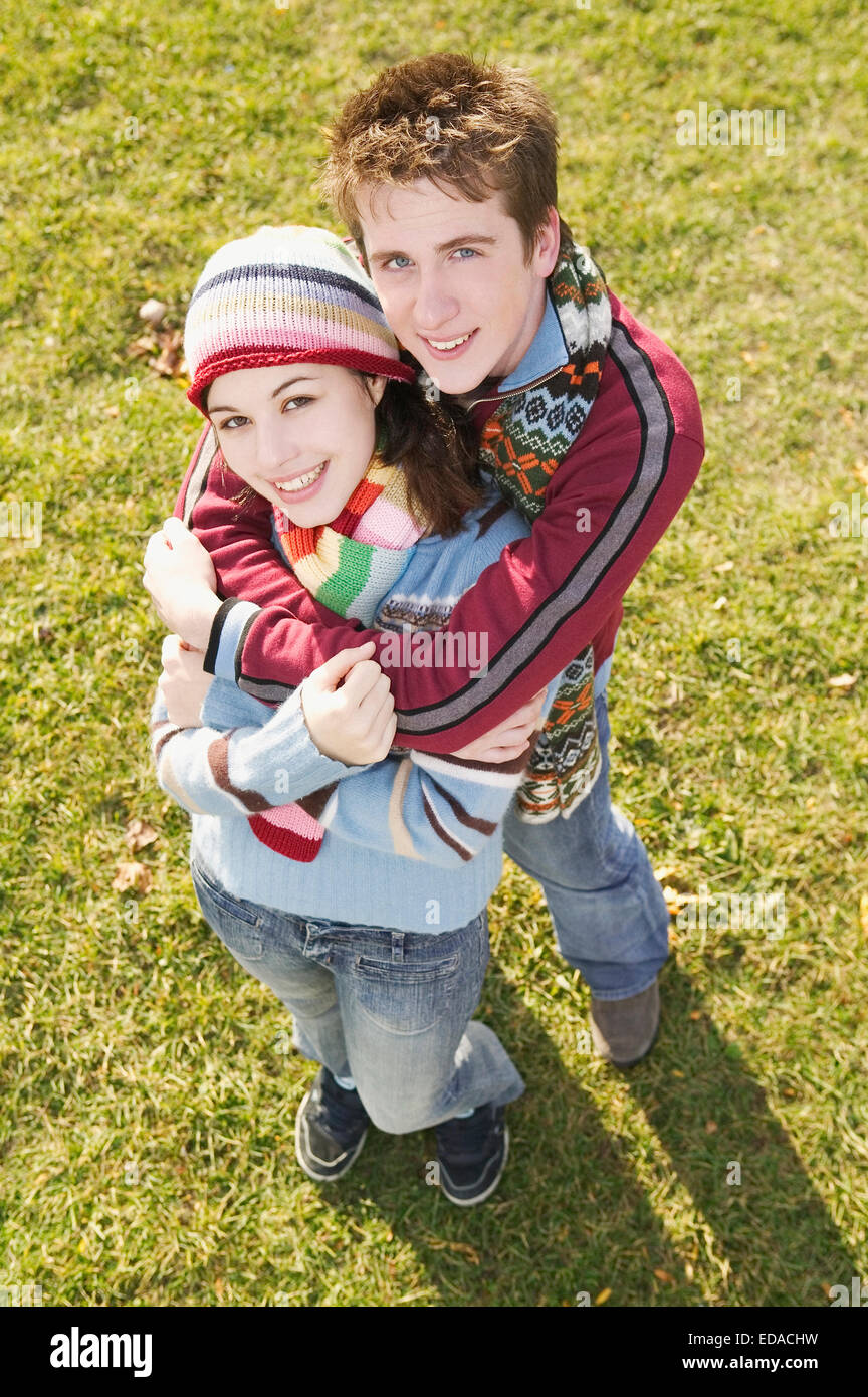 Couple in a park hugging Stock Photo - Alamy