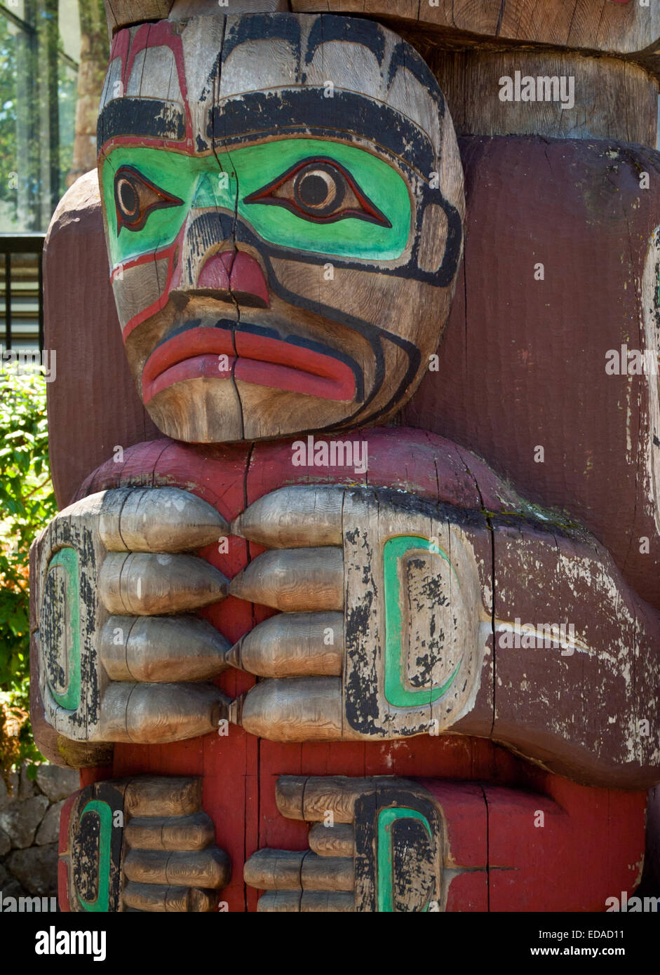 A close-up of a totem pole in front of the Royal BC Museum in Victoria, British Columbia, Canada. Stock Photo