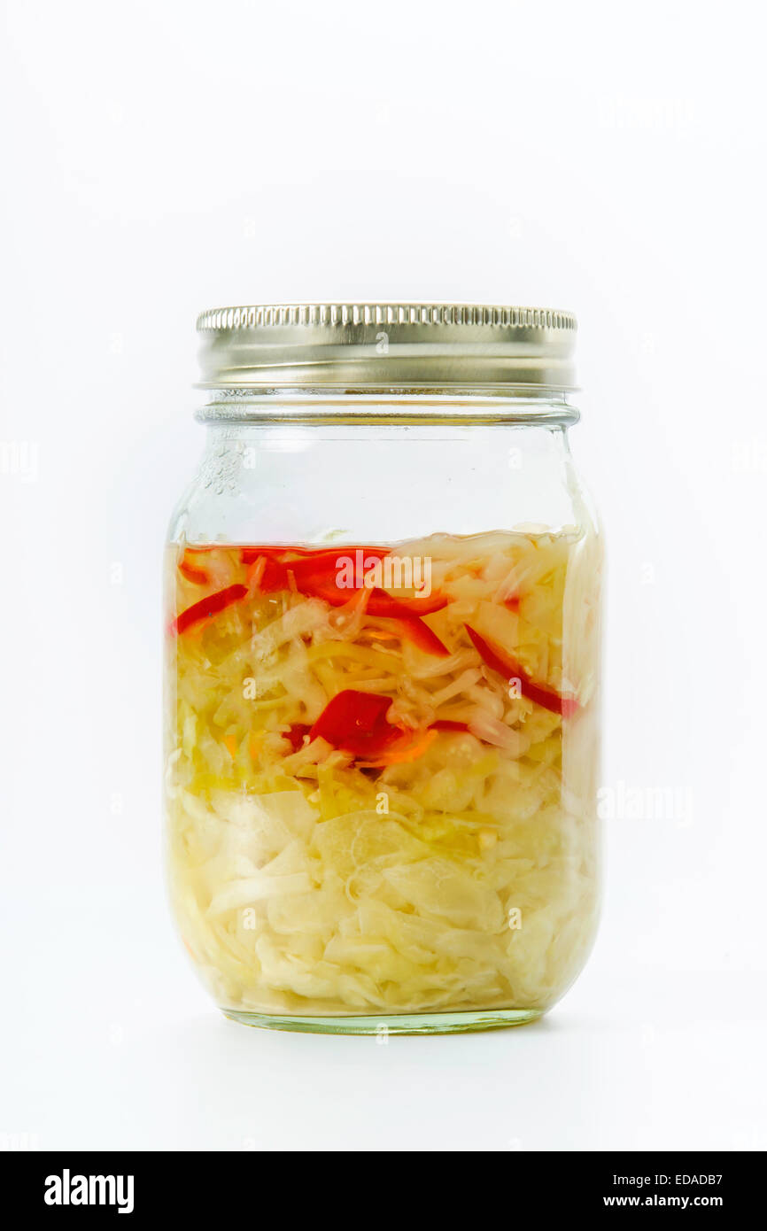 Jar of fermented cabbage sauerkraut on white Stock Photo