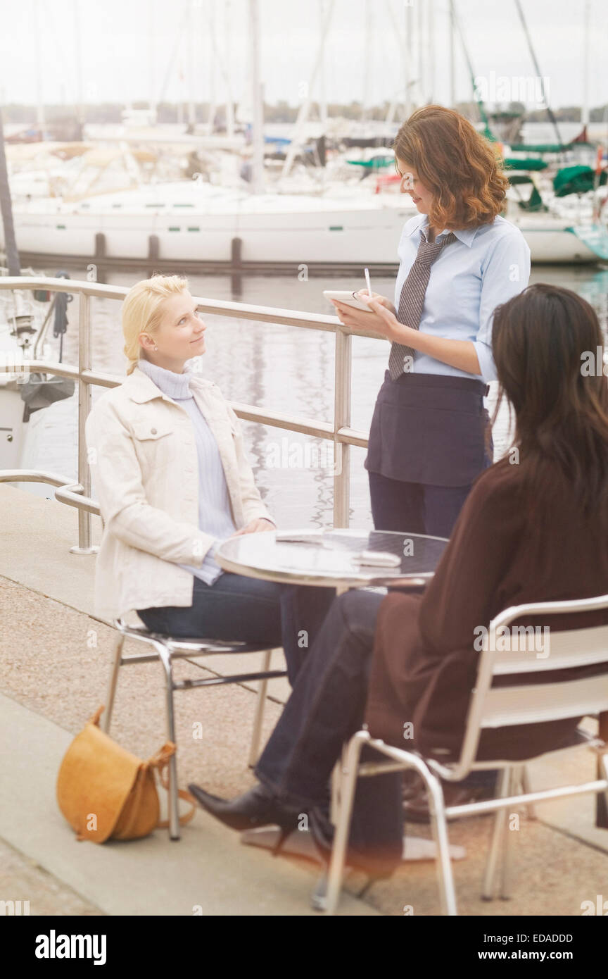 woman relaxing at an open air cafe Stock Photo