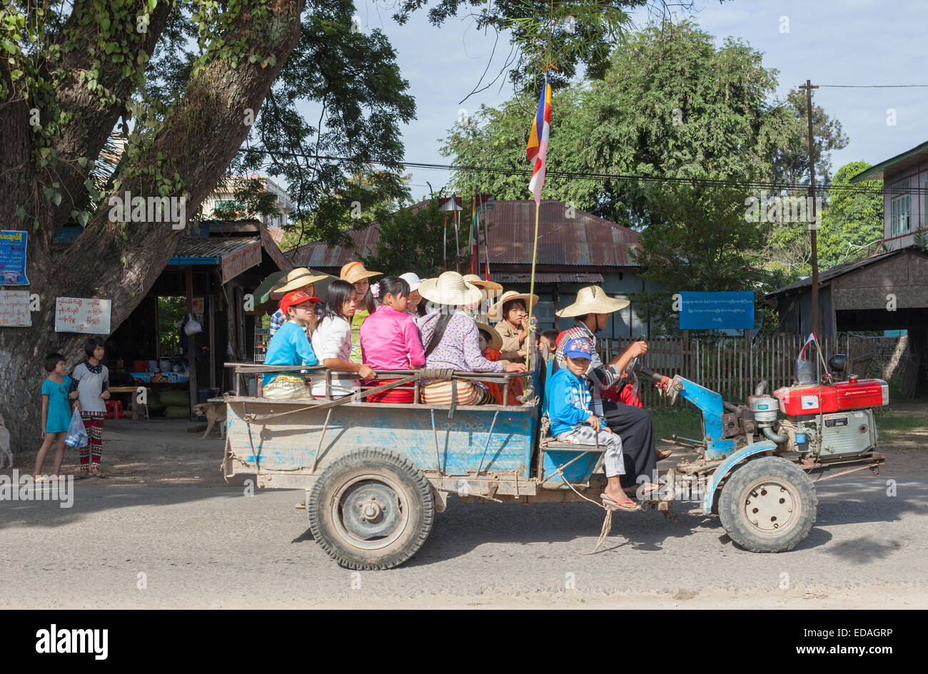 Religious procession using a cart towed by a Chinese built Jieneng tractor unit, Hsipaw, Shan State, Myanmar Stock Photo