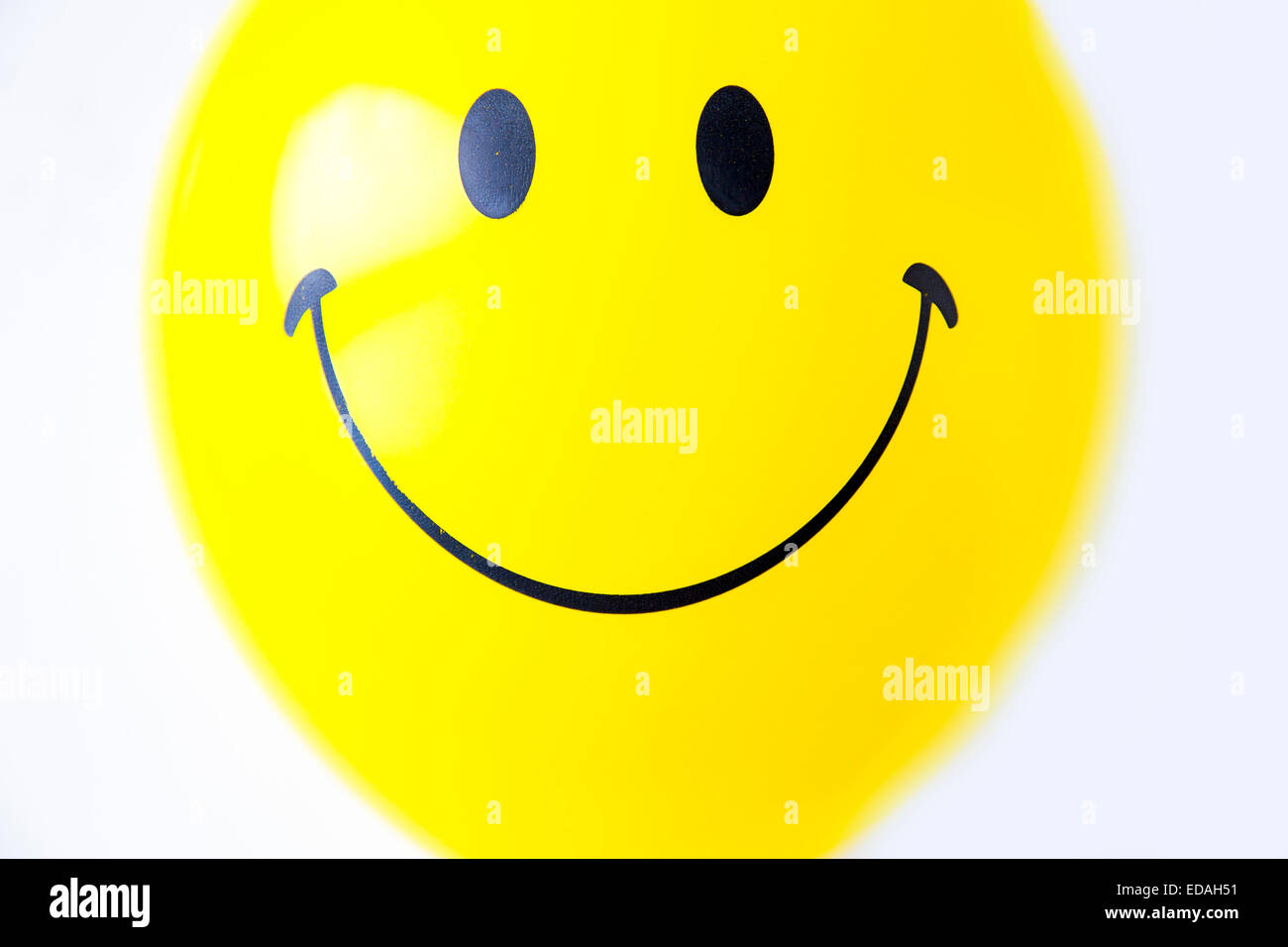 Balloon, yellow, with friendly smiley face Stock Photo
