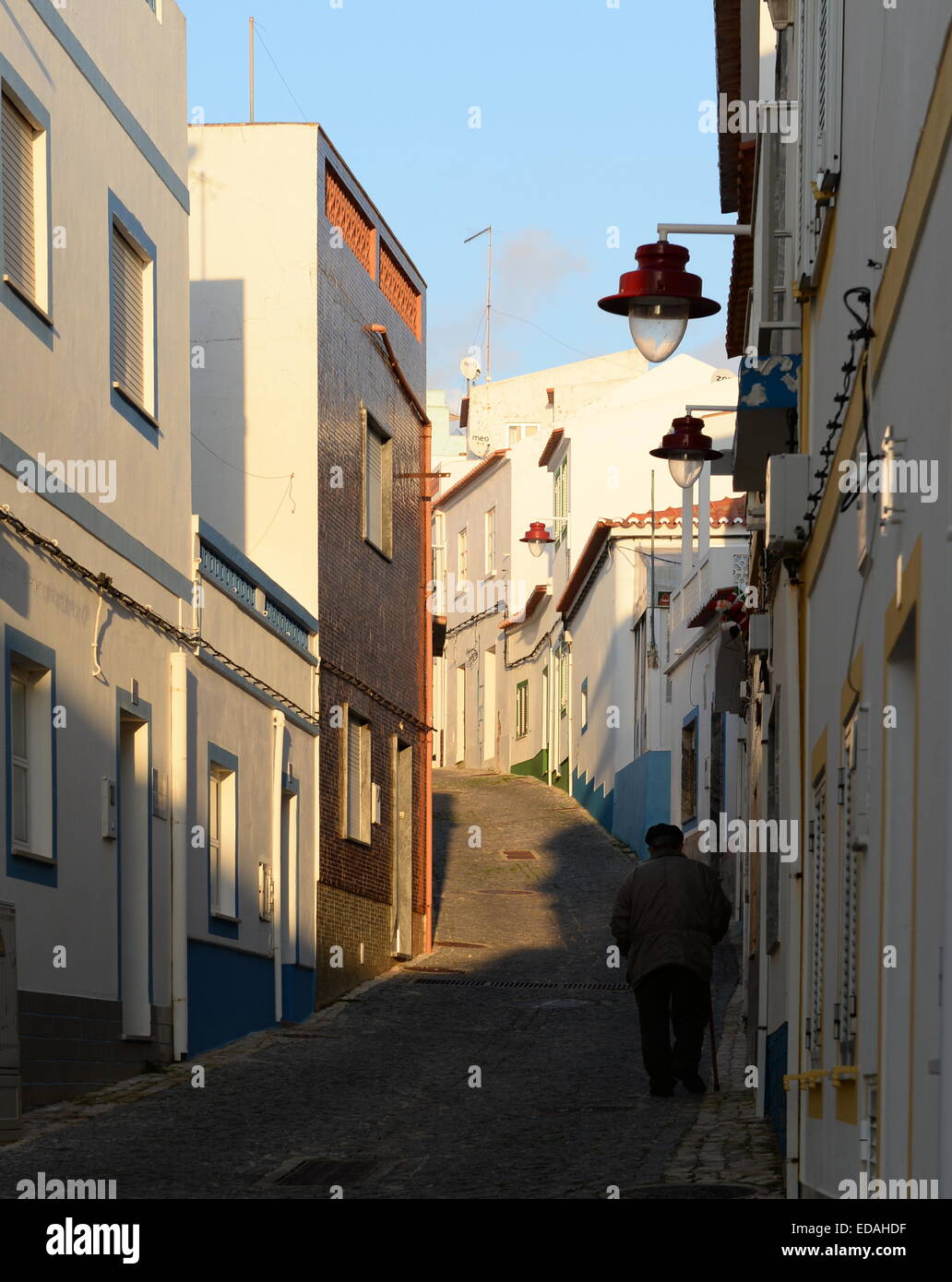 Rue de Pescadores cobbled street with old person Stock Photo