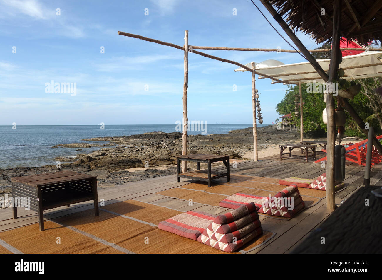 Low seating Thai floor mats on empty wooden deck at bamboo bay, Koh