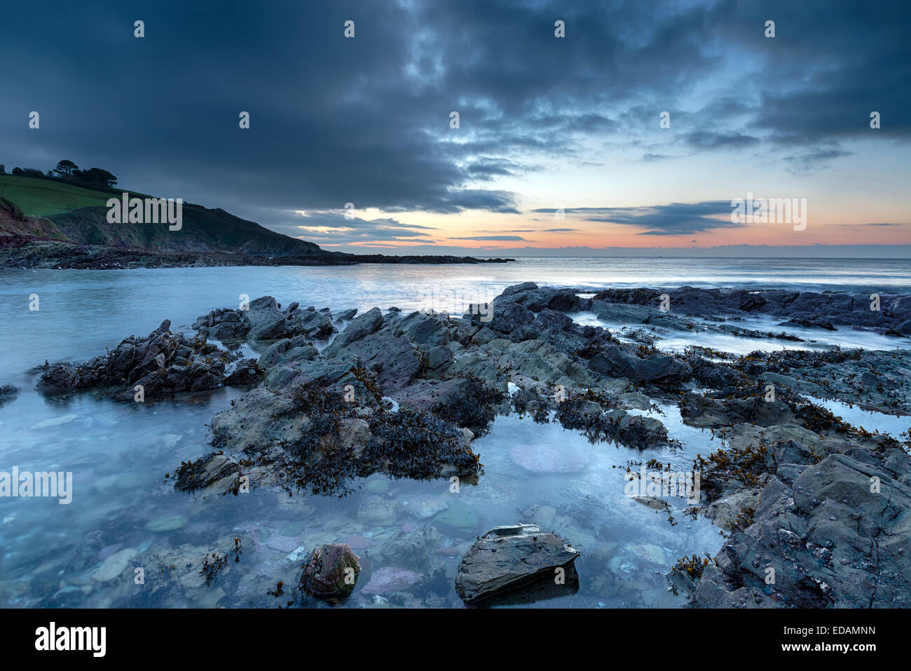 Dawn at Talland Bay on the south Cornwall Coast Stock Photo