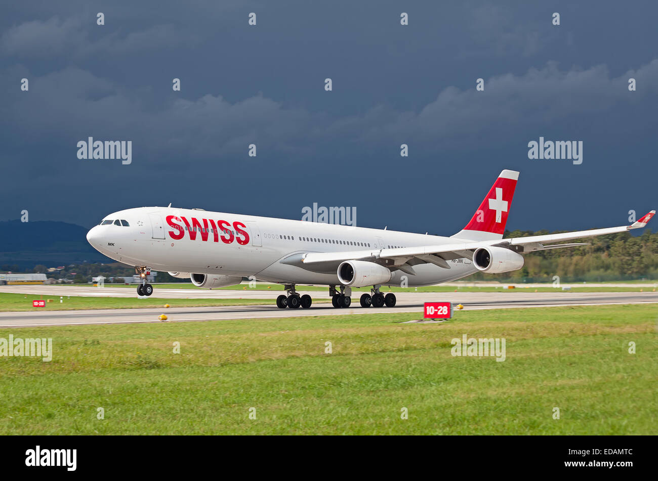 ZURICH - SEPTEMBER 21: Swiss Air A-340 taking off on September 21, 2014 in Zurich, Switzerland. Zurich airport is home port for  Stock Photo