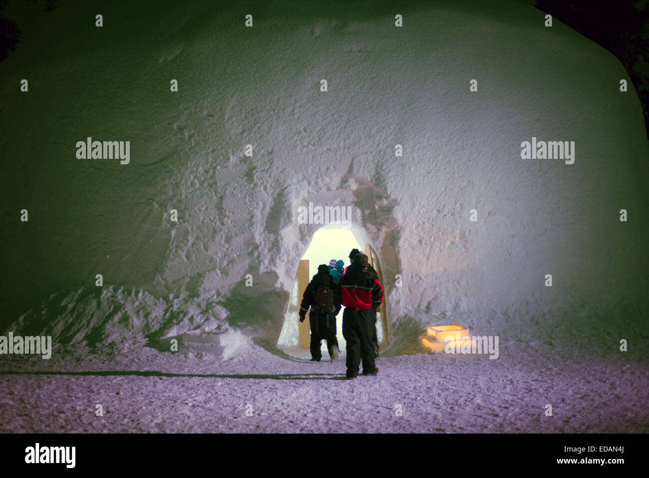 People entering large iglo ice hotel in lapland Stock Photo