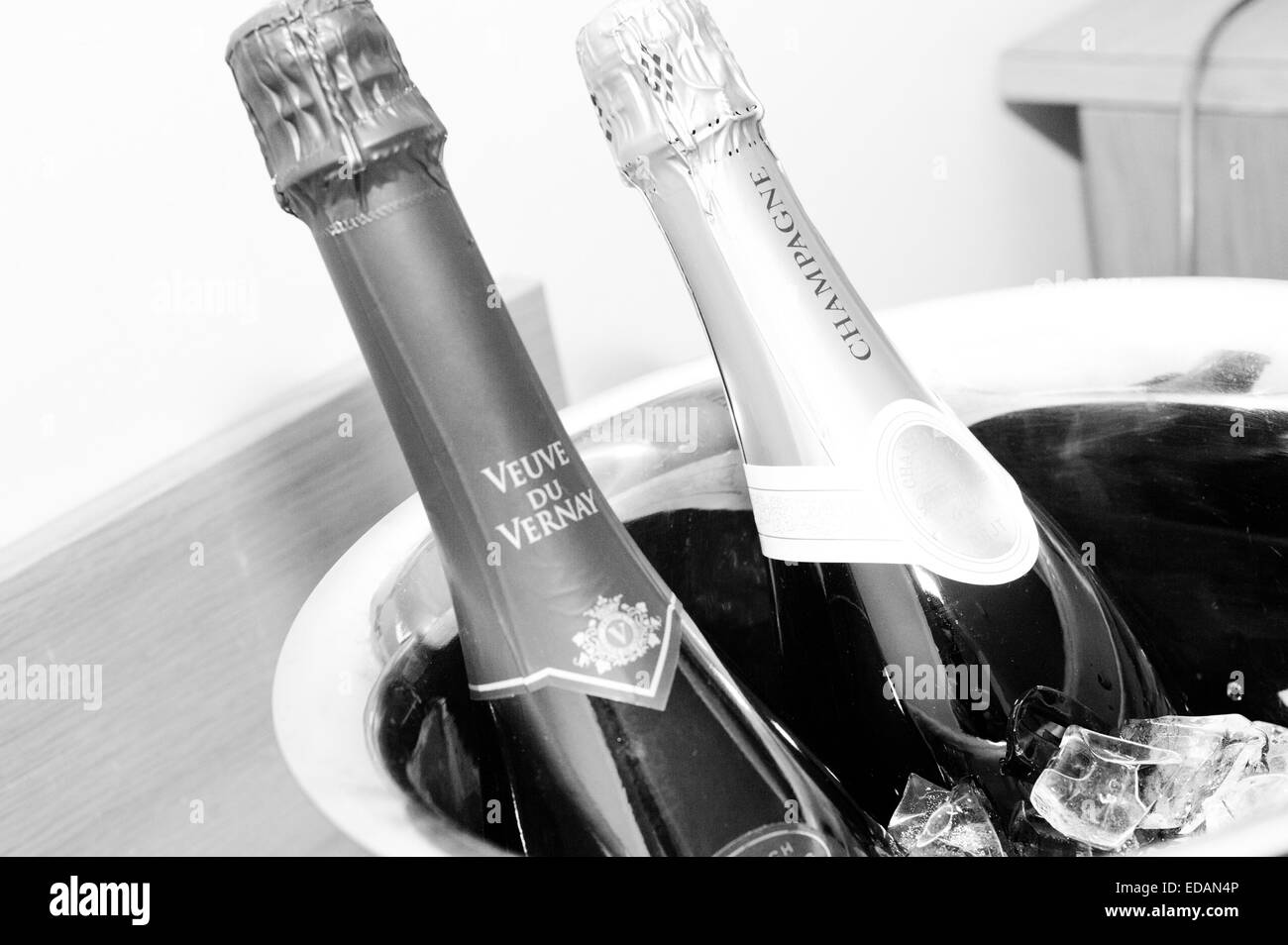 two champagne bottles on ice Stock Photo