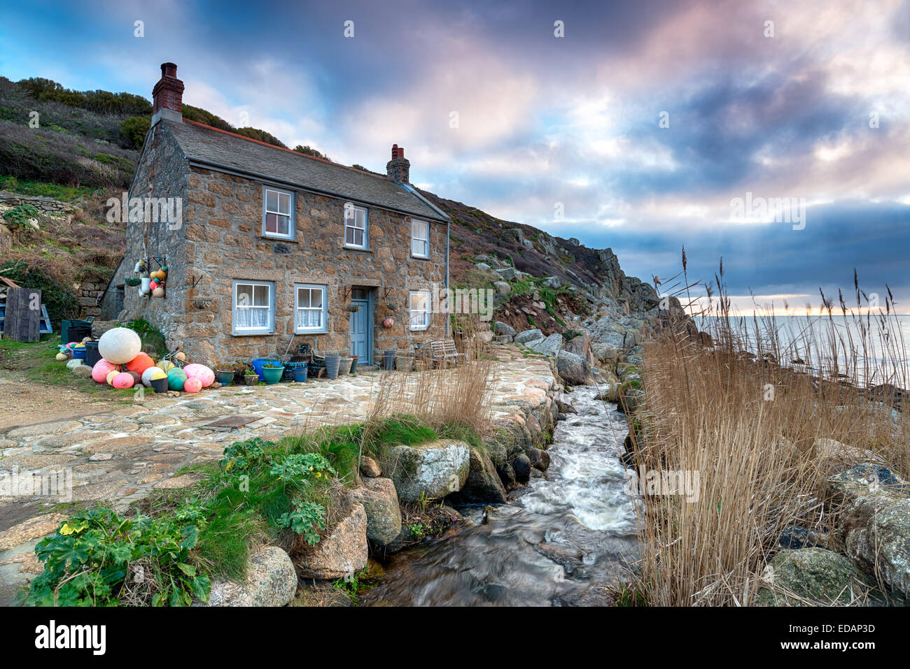 Old fisherman's cottage on the South West Coast Path at Penberth Cove, a small fishing village near Penzance in Cornwall Stock Photo