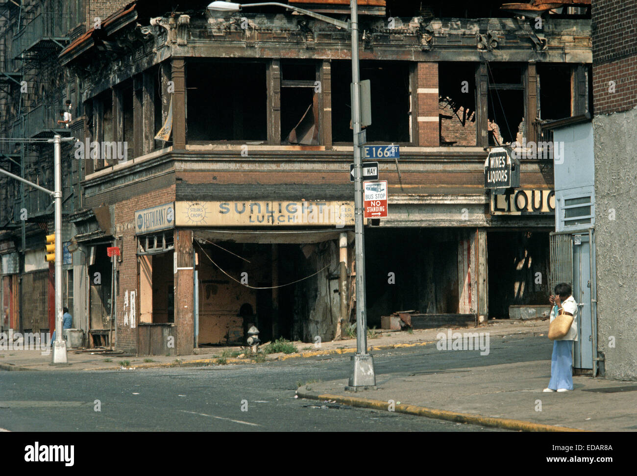 USA, SOUTH BRONX, NEW YORK CITY AUGUST 1977. Abandoned burntout tenement blocks and shops