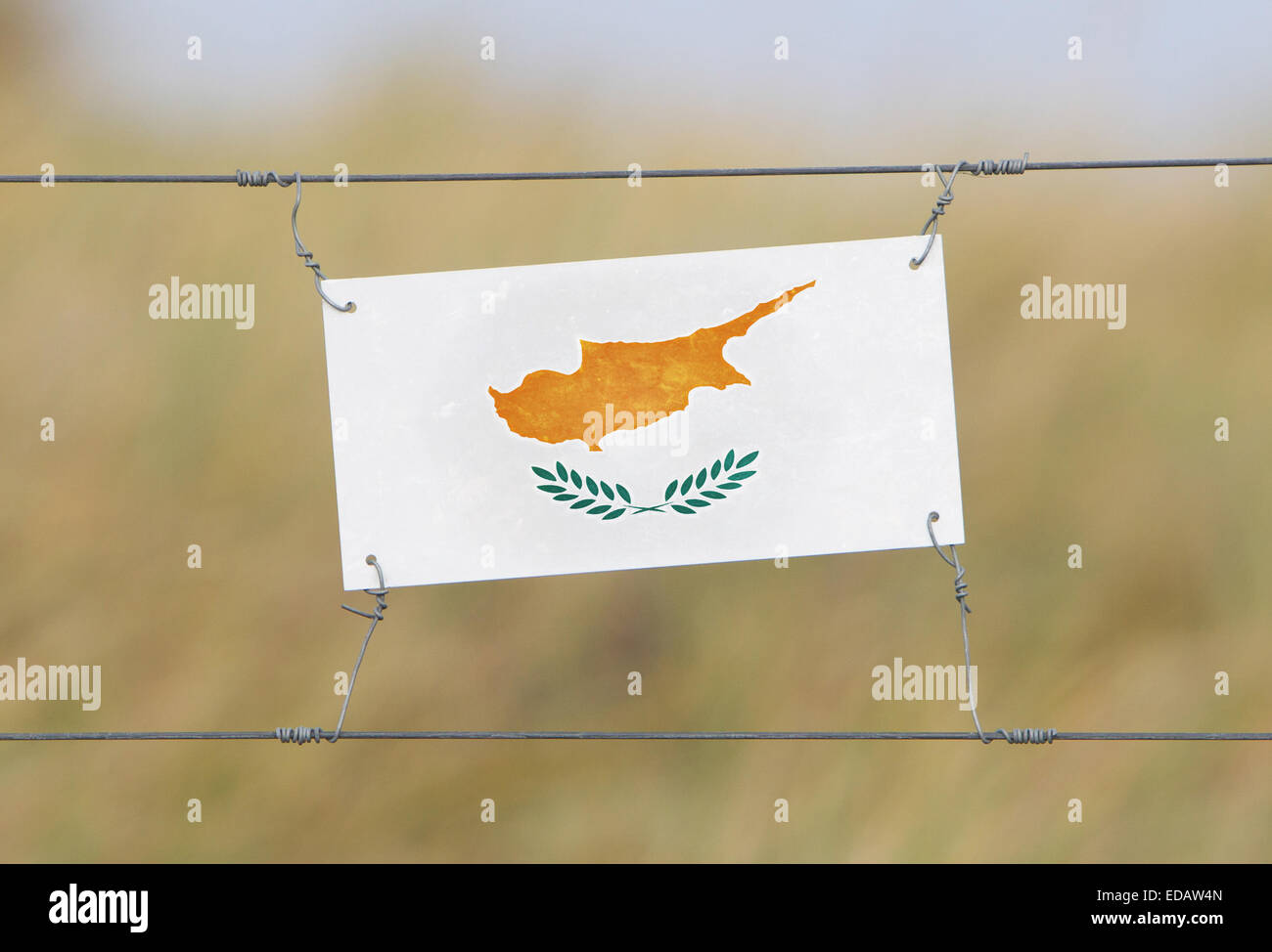 Border fence Old plastic sign with a flag Cyprus Stock Photo Alamy