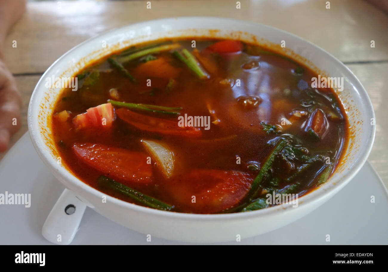 Tom yum or tom yam soup served in a ceramic bowl, Thailand, Asia. Stock Photo