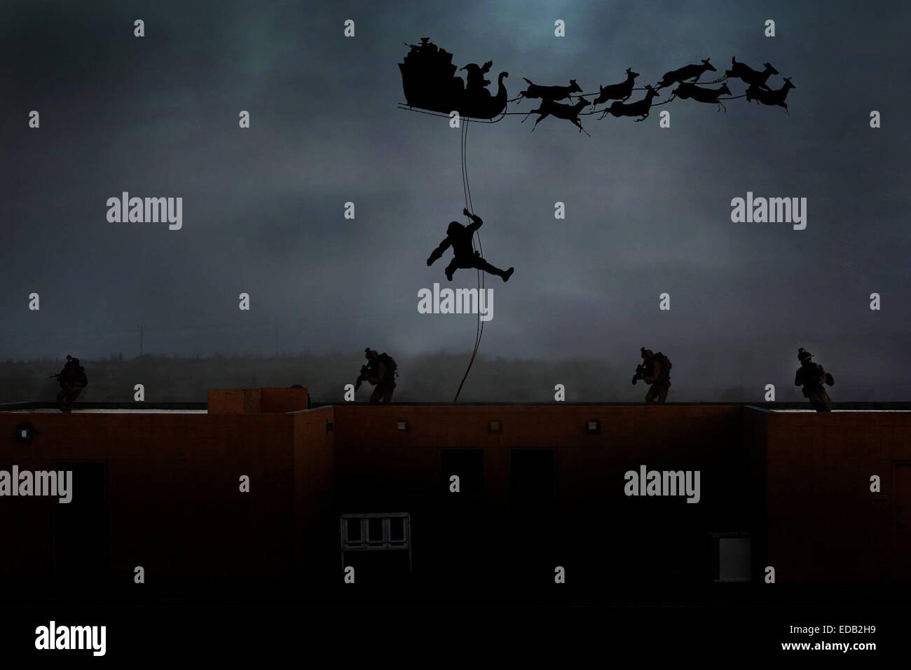 US Marines reconnaissance commandos repel down from Santa's sleigh during Christmas in a photo illustration December 24, 2014. Stock Photo