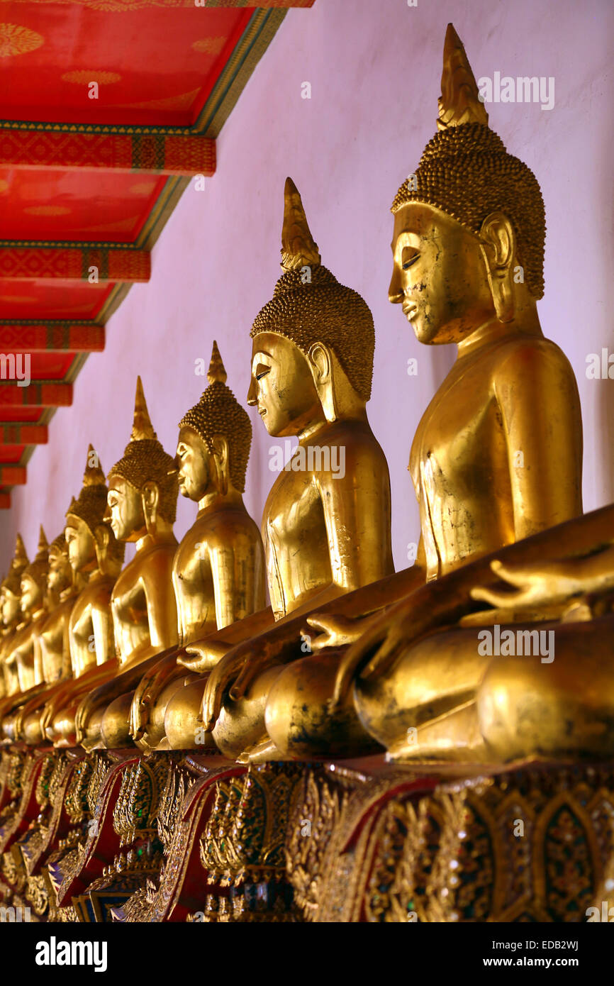 Gold Buddha statues at the Wat Pho Temple Bangkok, Thailand Stock Photo ...