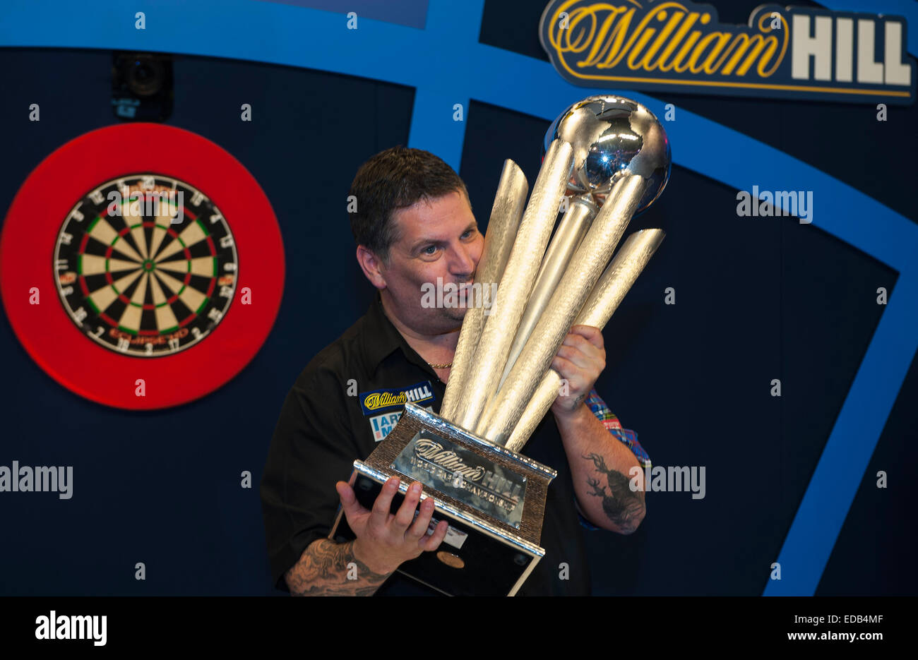 London, UK. 04th Jan, 2015. William Hill PDC World Darts Championship.  Finals Night. Gary Anderson (4) [SCO] lifts the Sid Waddell Trophy after  beating Phil Taylor (2) [ENG] 7-6 in the final.