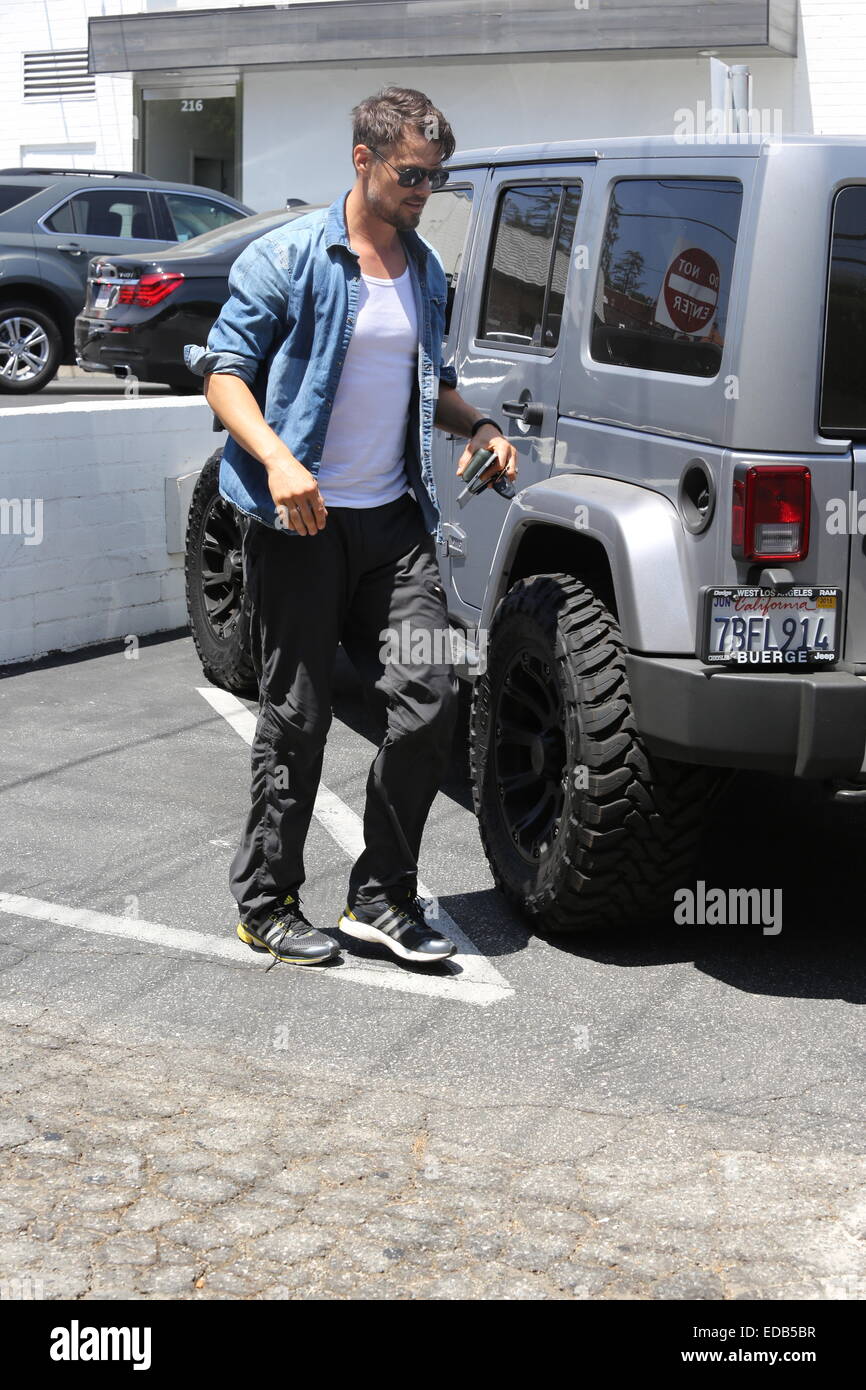A bearded Josh Duhamel parks his Jeep and visits his office in