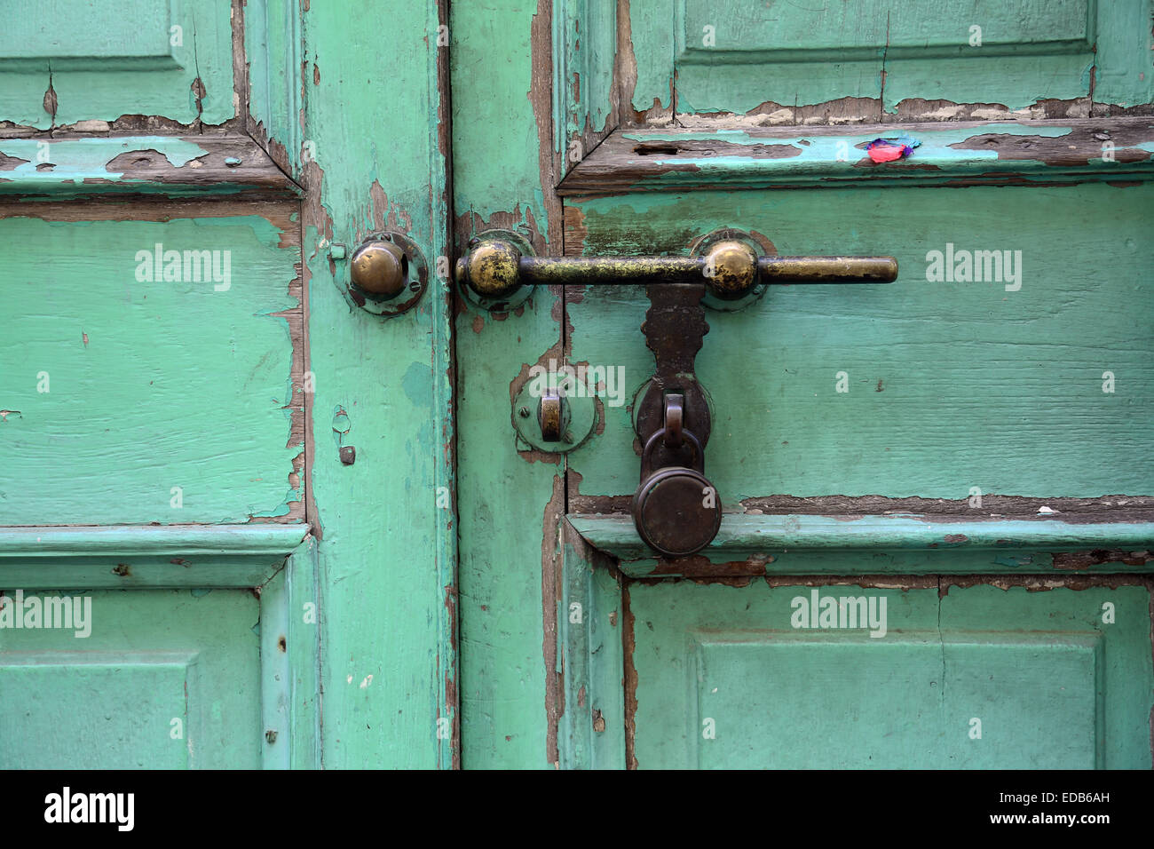 Ancient rusty door latch with padlock Stock Photo