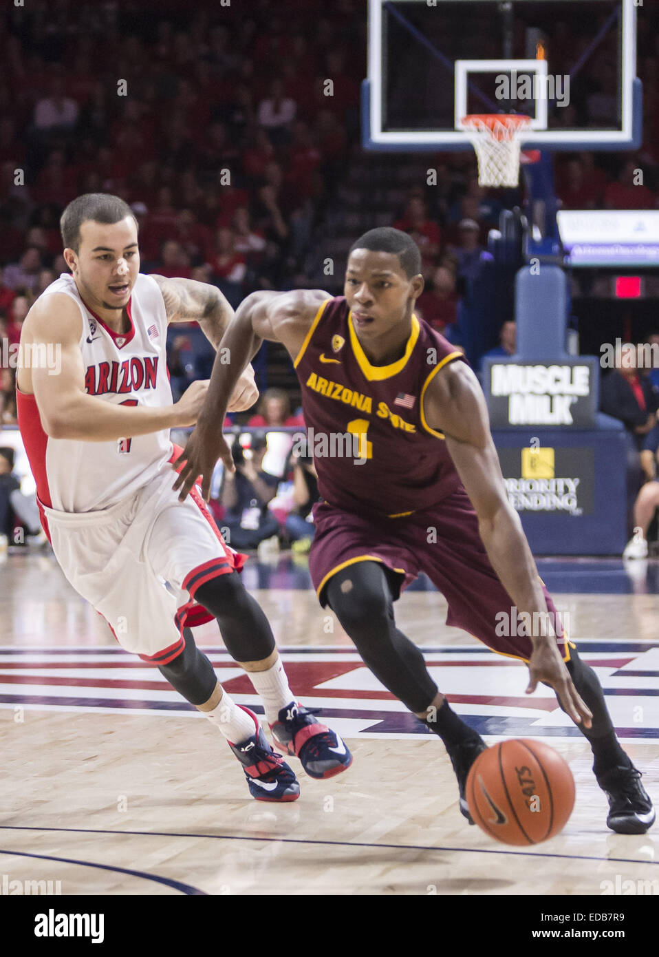 Tucson, Arizona, USA. 4th Jan, 2015. Arizona State Sun Devils guard ROOSEVELT SCOTT (1) drives the ball down the court past Arizona Wildcats guard GABE YORK (1) at the McKale Center on Sunday, Jan. 4, 2015 in Tucson, Ariz. Arizona Wildcats defeated the Arizona State Sun Devils 73 - 49. © Ryan Revock/ZUMA Wire/ZUMAPRESS.com/Alamy Live News Stock Photo