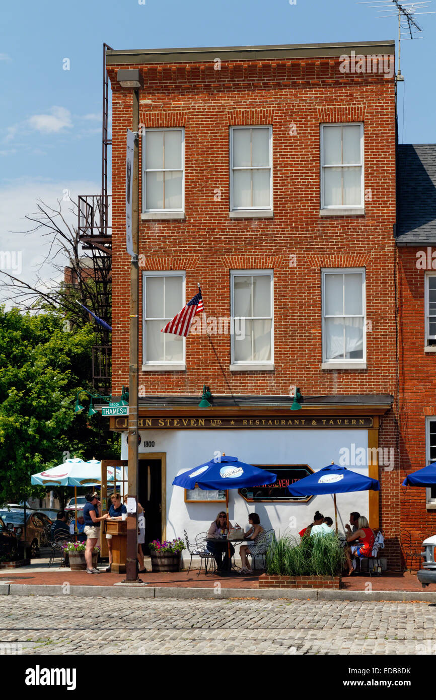 View of a Pub with Outdoor Tables During the Summer Tourist Season, Fells Point, Baltimore, Maryland Stock Photo