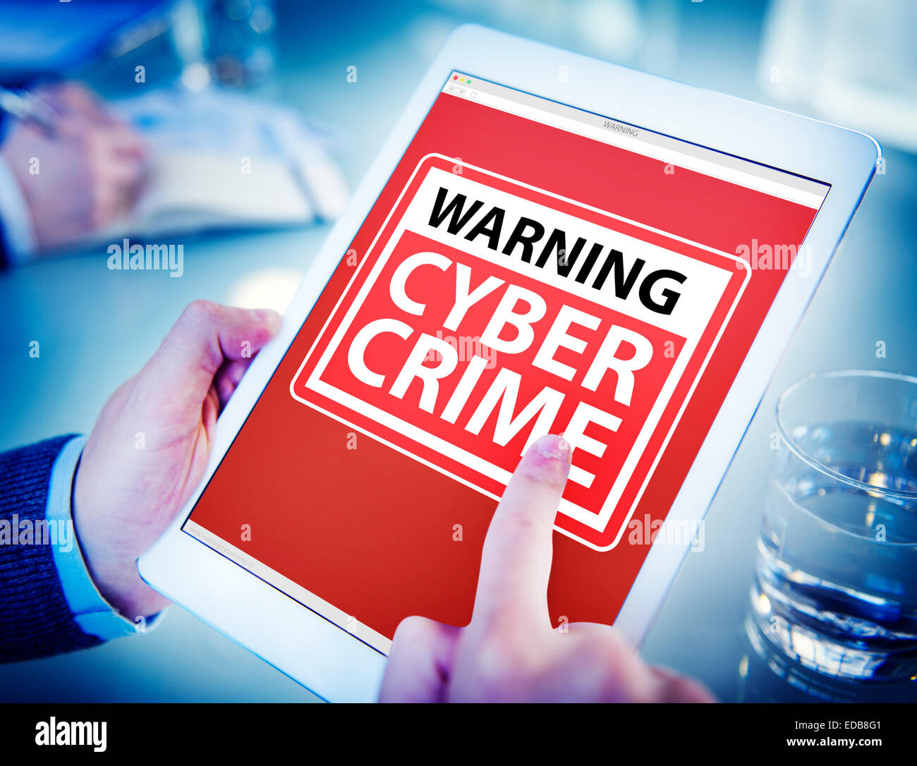 Hands Holding Digital Tablet Cyber Crime Stock Photo