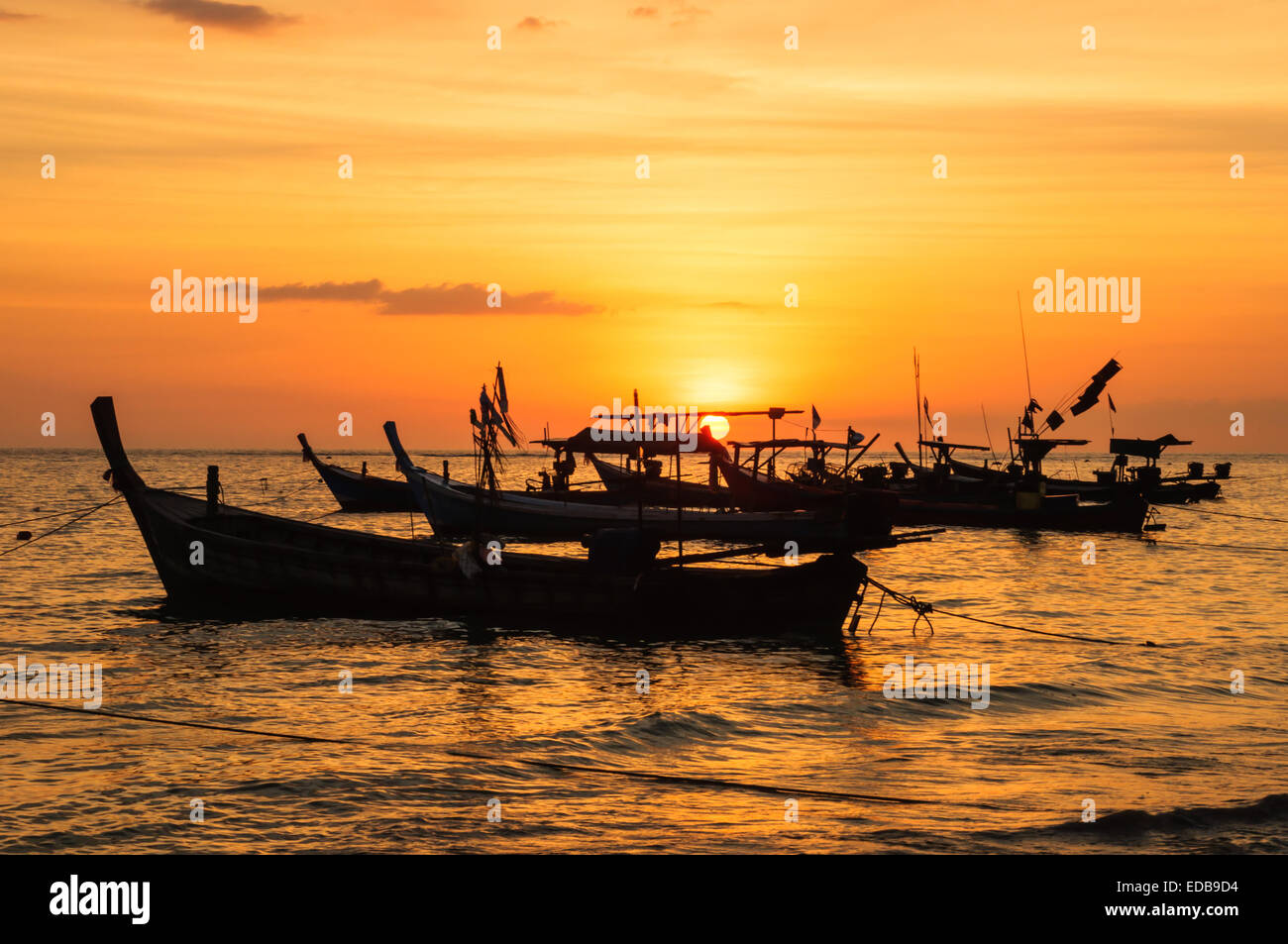 Silhouette boat at beach and sunset Stock Photo - Alamy