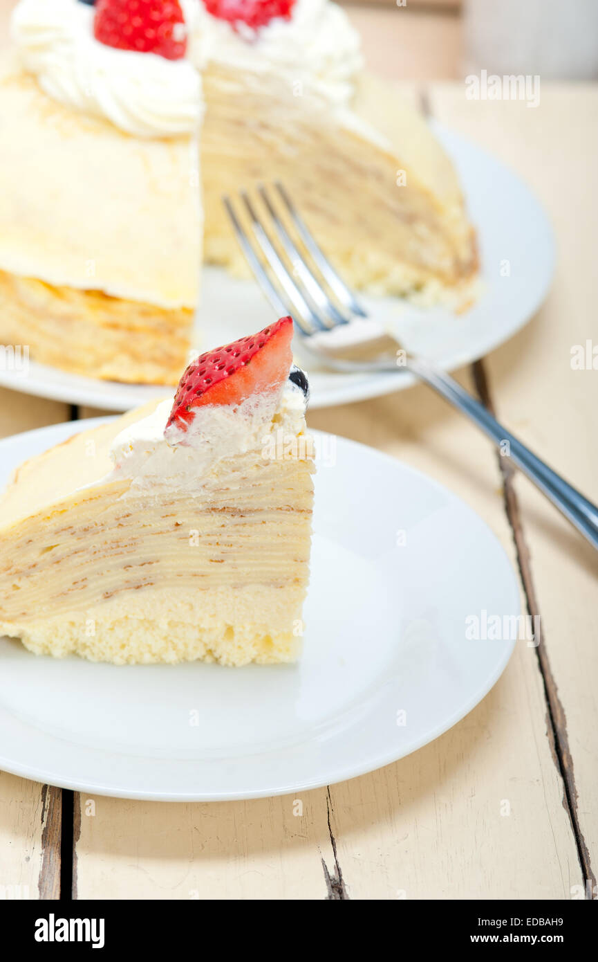 crepe pancake cake with whipped cream and strawberry on top Stock Photo